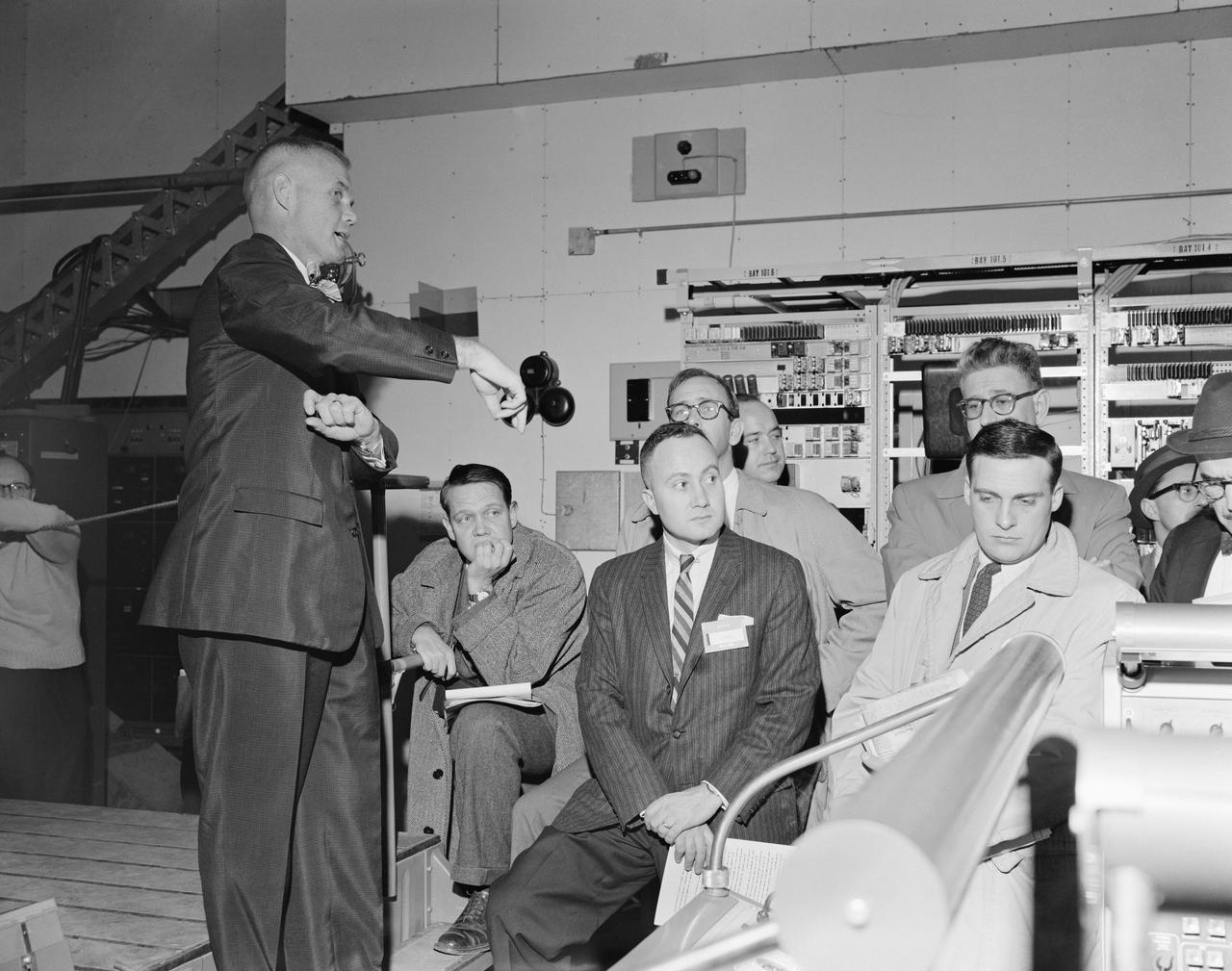 M61-00041 (January 1961) --- Astronaut John Glenn and news media representatives are pictured during a press conference and spacecraft familiarization tour of Cape Canaveral, Florida. Photo credit: NASA