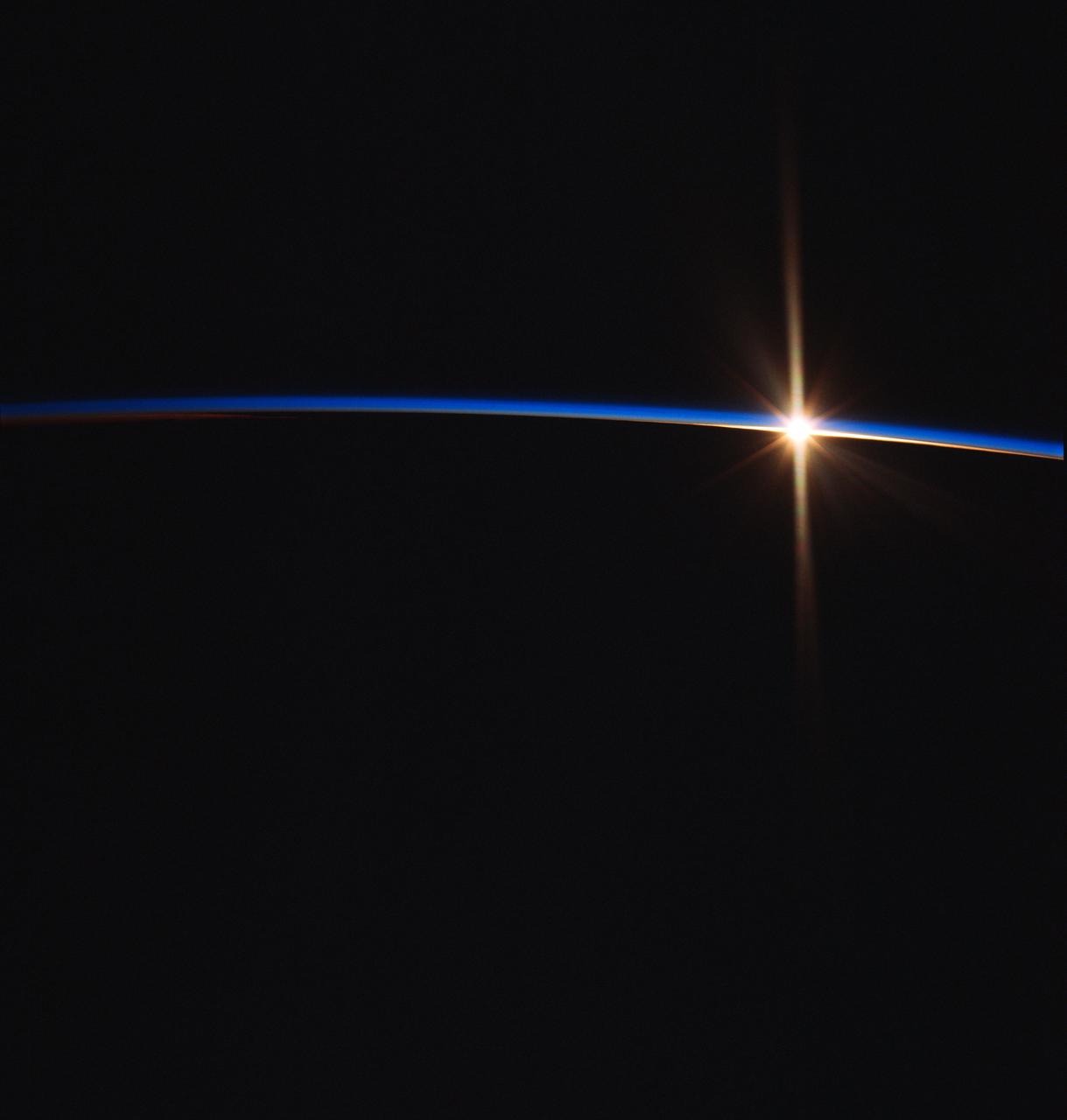 NASA7-726-049 (May 1998) --- This view of a sunrise was taken as the Russia's Mir Space Station was on a descending track toward Johnston Island, in the central Pacific (18.1 degrees north latitude and 176.6 degrees west longitude). Sunrises and sunsets are seen by the astronauts and cosmonauts approximately every 45 minutes and differ in structure, since the tropopause altitude and atmospheric lamina temperatures vary with time of day, season, and latitude. From accounts by the astronauts, true replication of human vision is not possible using present film. Some have said there are many more layers in the atmosphere than what the film is recording.