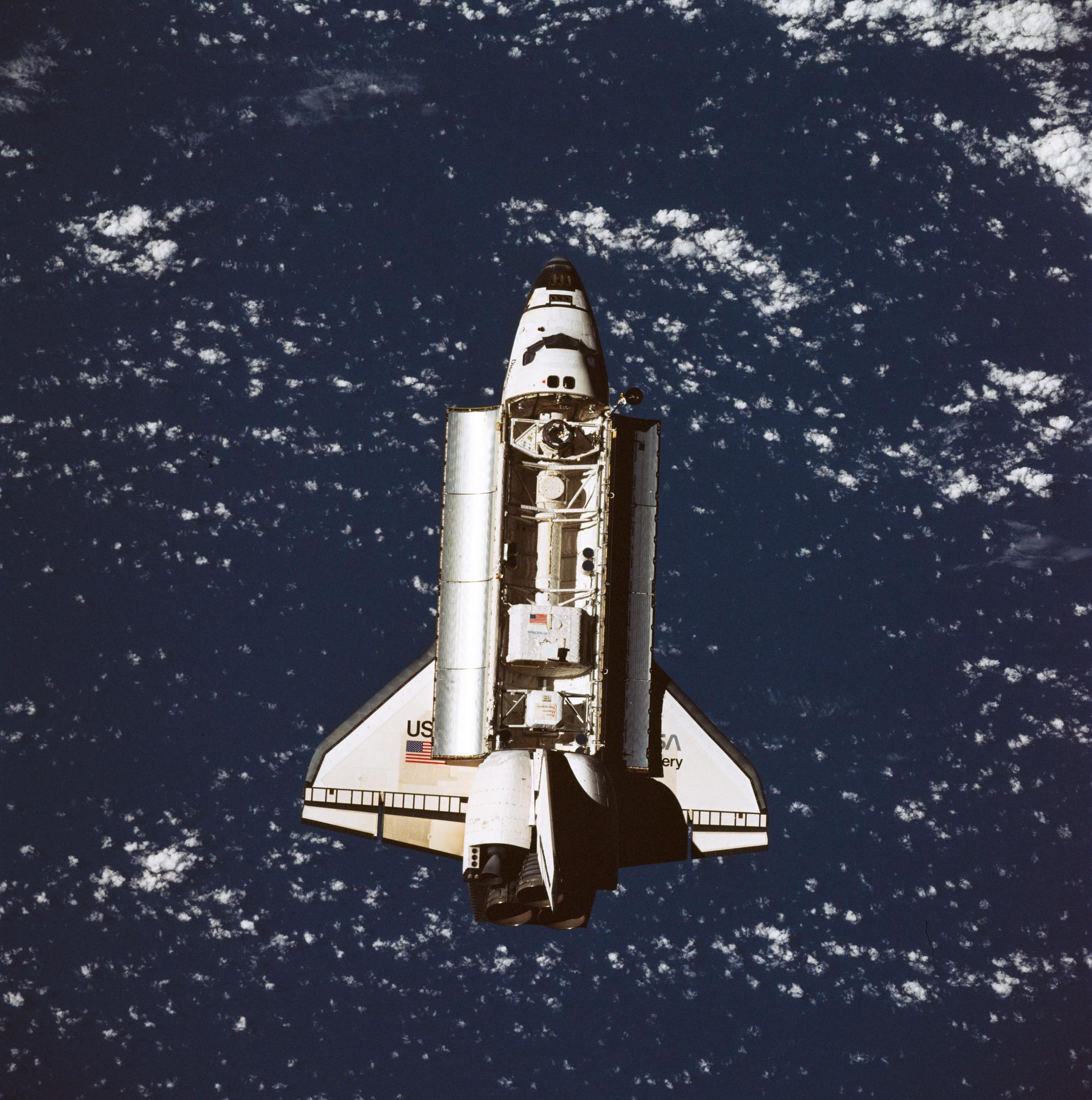The Space Shuttle Discovery approaches Russia's Mir space station.