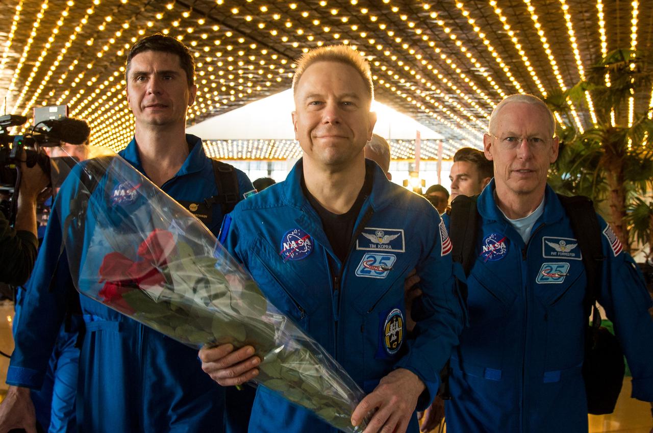 Expedition 47 astronaut Tim Kopra of NASA, center, arrives at the Karaganda Airport in Kazakhstan a few hours after he, Yuri Malenchenko of Roscosmos, and Tim Peake of the European Space Agency landed in their Soyuz TMA-19M spacecraft near the town of Zhezkazgan, Kazakhstan on Saturday, June 18, 2016. Kopra, Peake, and Malenchenko are returning after six months in space where they served as members of the Expedition 46 and 47 crews onboard the International Space Station. Photo Credit: (NASA/Bill Ingalls)