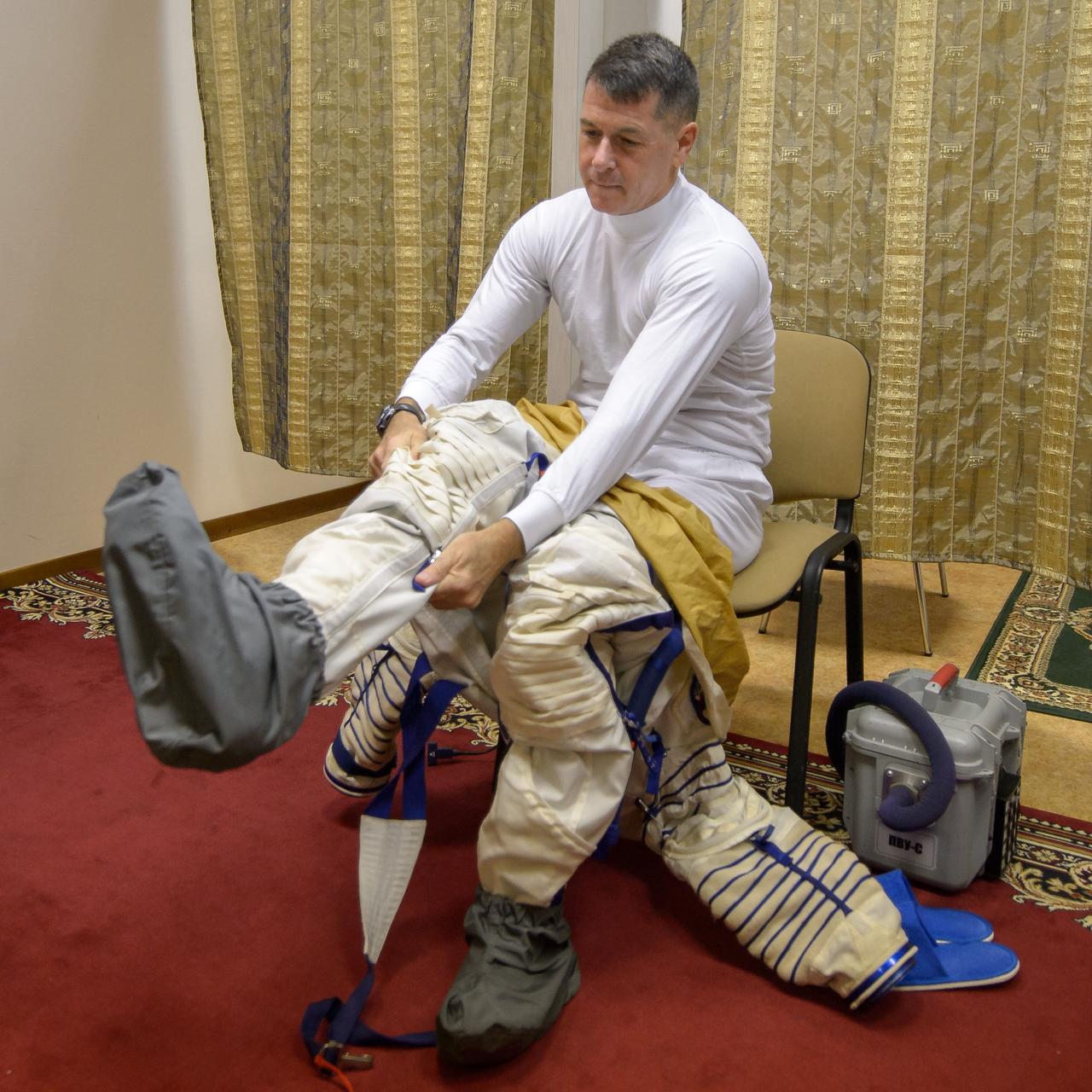 Expedition 49 NASA astronaut Shane Kimbrough dons his Russian Sokol suit ahead of the Soyuz qualification exams with Russian cosmonaut Sergei Ryzhikov and Russian cosmonaut Andrey Borisenko of Roscosmos, Wednesday, Aug. 31, 2016, at the Gagarin Cosmonaut Training Center (GCTC) in Star City, Russia. Photo Credit: (NASA/Bill Ingalls)