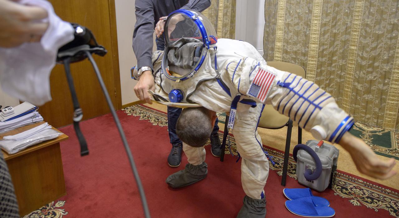 Expedition 49 NASA astronaut Shane Kimbrough dons his Russian Sokol suit ahead of the Soyuz qualification exams with Russian cosmonaut Sergei Ryzhikov and Russian cosmonaut Andrey Borisenko of Roscosmos, Wednesday, Aug. 31, 2016, at the Gagarin Cosmonaut Training Center (GCTC) in Star City, Russia. Photo Credit: (NASA/Bill Ingalls)