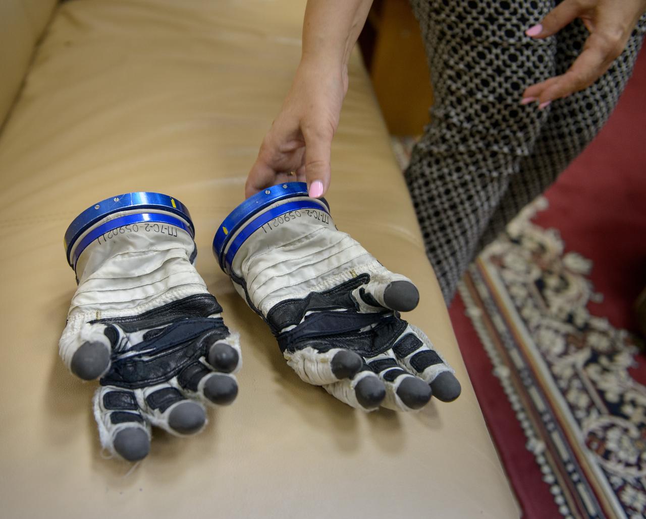 Russian Sokol suit gloves are seen as Expedition 49 NASA astronaut Shane Kimbrough, and Russian cosmonauta Sergei Ryzhikov of Roscosmos and Andrey Borisenko of Roscosmos don their Russian Sokol suits ahead of their Soyuz qualification exams, Wednesday, Aug. 31, 2016, at the Gagarin Cosmonaut Training Center (GCTC) in Star City, Russia. Photo Credit: (NASA/Bill Ingalls)