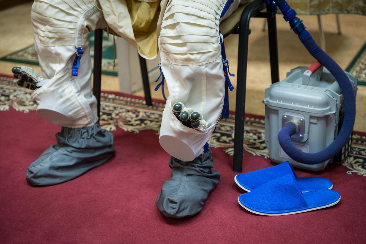 Expedition 49 NASA astronaut Shane Kimbrough dons his Russian Sokol suit ahead of the Soyuz qualification exams with Russian cosmonaut Sergei Ryzhikov and Russian cosmonaut Andrey Borisenko of Roscosmos, Wednesday, Aug. 31, 2016, at the Gagarin Cosmonaut Training Center (GCTC) in Star City, Russia. Photo Credit: (NASA/Bill Ingalls)