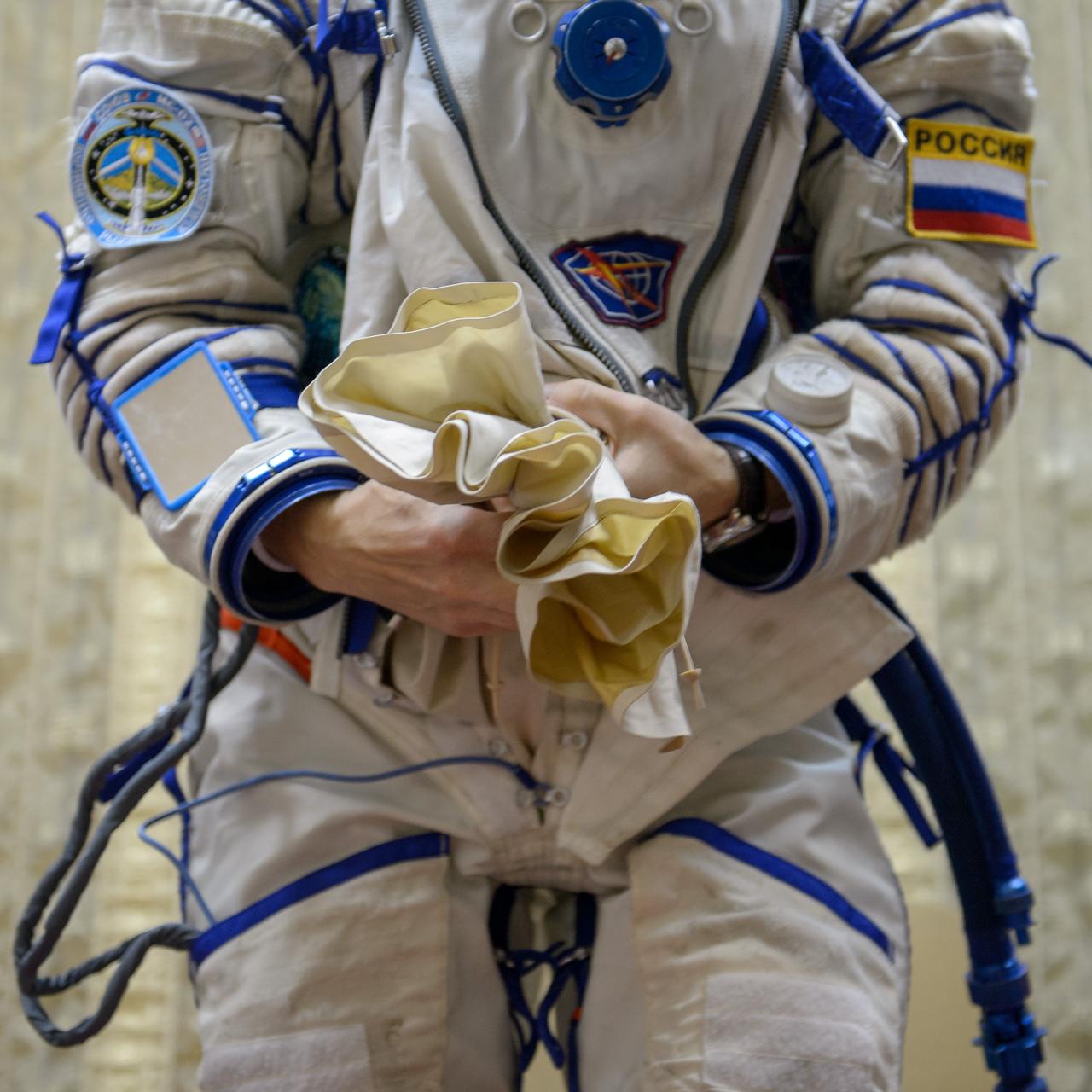 Expedition 49 Russian cosmonaut Sergei Ryzhikov of Roscosmos dons his Russian Sokol suit ahead of the Soyuz qualification exams with fellow Russian cosmonaut Andrey Borisenko of Roscosmos and NASA astronaut Shane Kimbrough, Wednesday, Aug. 31, 2016, at the Gagarin Cosmonaut Training Center (GCTC) in Star City, Russia. Photo Credit: (NASA/Bill Ingalls)