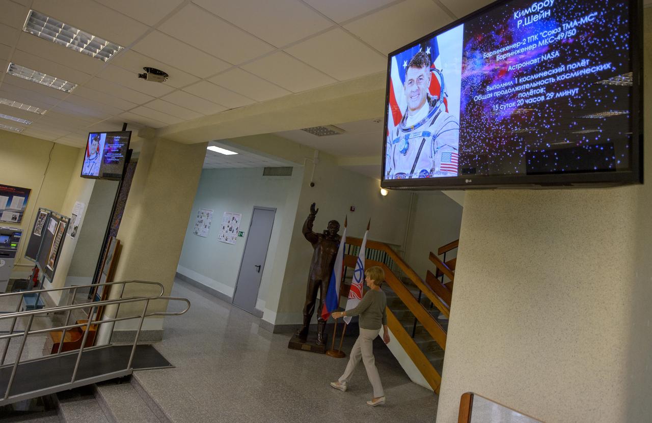Expedition 49 NASA astronaut Shane Kimbrough's photograph is seen on a television monitor in the hallway of the Soyuz Simulation Facility as he and Russian cosmonauts Sergei Ryzhikov and Andrey Borisenko of Roscosmos take their final Soyuz qualification exams, Wednesday, Aug. 31, 2016, at the Gagarin Cosmonaut Training Center (GCTC) in Star City, Russia. Photo Credit: (NASA/Bill Ingalls)