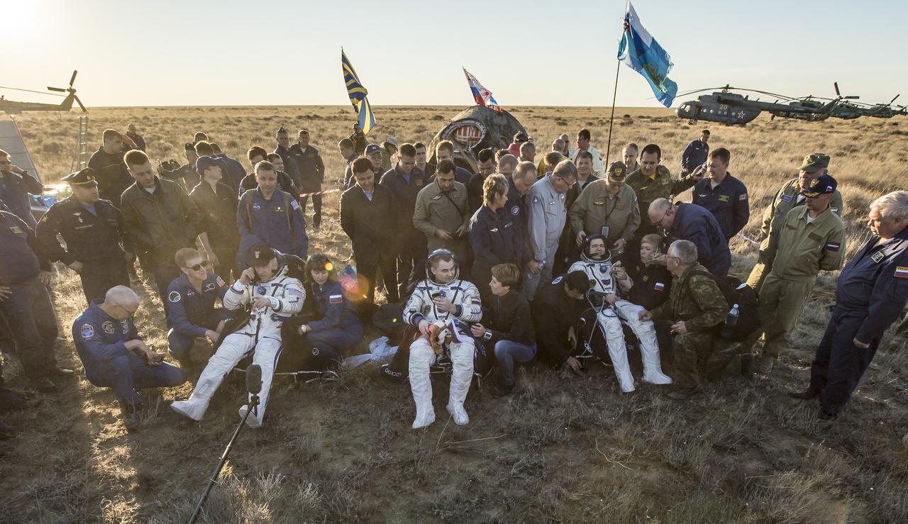 NASA astronaut Jeff Williams, left, Russian cosmonaut Alexey Ovchinin of Roscosmos, center, and Russian cosmonaut Oleg Skripochka of Roscosmos sit in chairs outside the Soyuz TMA-20M spacecraft a few moments after they landed in a remote area near the town of Zhezkazgan, Kazakhstan on Wednesday, Sept. 7, 2016(Kazakh time). Williams, Ovchinin, and Skripochka are returning after 172 days in space where they served as members of the Expedition 47 and 48 crews onboard the International Space Station. Photo Credit: (NASA/Bill Ingalls)