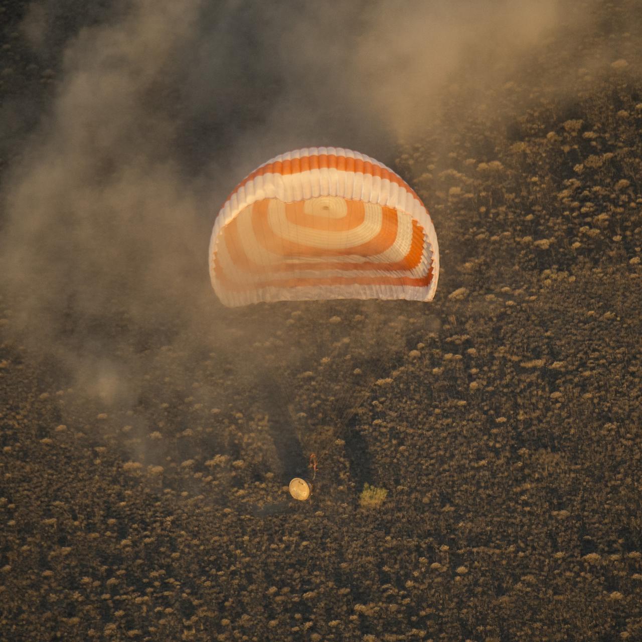 The Soyuz TMA-20M spacecraft is seen as it lands with Expedition 48 crew members NASA astronaut Jeff Williams, Russian cosmonauts Alexey Ovchinin, and Oleg Skripochka of Roscosmos near the town of Zhezkazgan, Kazakhstan on Wednesday, Sept. 7, 2016(Kazakh time). Williams, Ovchinin, and Skripochka are returning after 172 days in space where they served as members of the Expedition 47 and 48 crews onboard the International Space Station. Photo Credit: (NASA/Bill Ingalls)