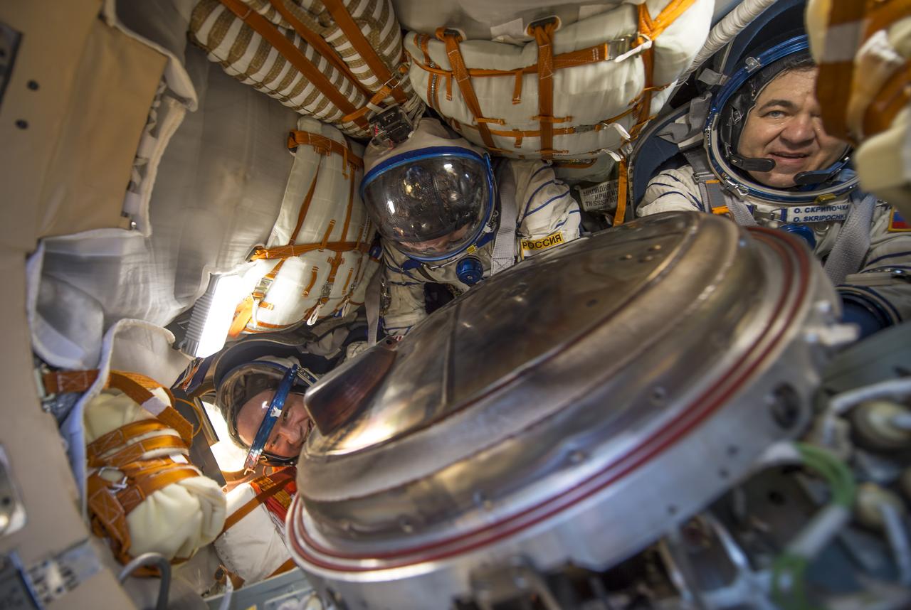 NASA astronaut Jeff Williams, left, Russian cosmonaut Alexey Ovchinin of Roscosmos, center, and Russian cosmonaut Oleg Skripochka of Roscosmos are seen inside the Soyuz TMA-20M spacecraft a few moments after they landed in a remote area near the town of Zhezkazgan, Kazakhstan on Wednesday, Sept. 7, 2016(Kazakh time). Williams, Ovchinin, and Skripochka are returning after 172 days in space where they served as members of the Expedition 47 and 48 crews onboard the International Space Station. Photo Credit: (NASA/Bill Ingalls)