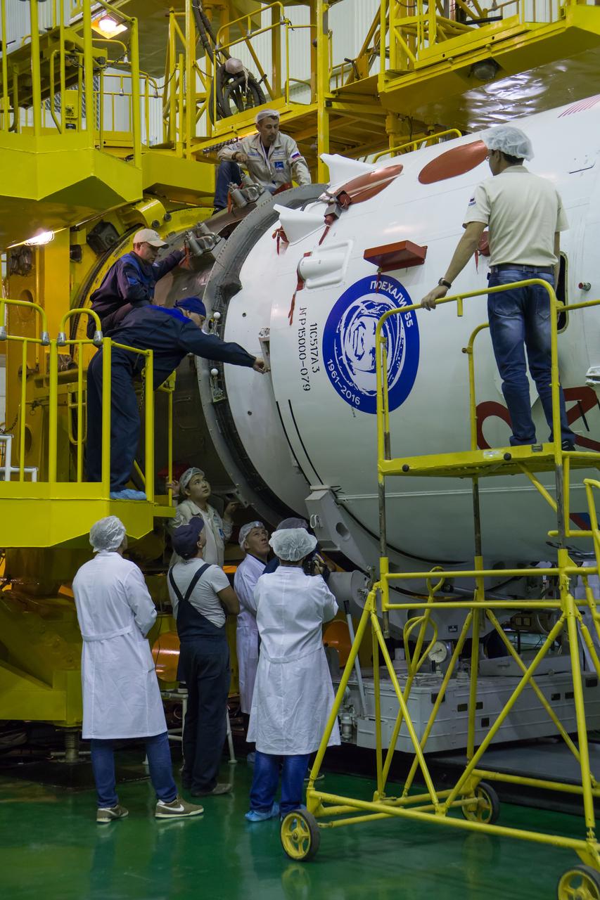 Workers monitor the encapsulation of the Soyuz MS-02 spacecraft in its fairing on Thursday, Sept. 15, 2016 at the Baikonur Cosmodrome in Kazakhstan. Expedition 49 flight engineer Shane Kimbrough of NASA, flight engineer Andrey Borisenko of Roscosmos, and Soyuz commander Sergey Ryzhikov of Roscosmos are scheduled to launch to the International Space Station aboard the Soyuz MS-02 spacecraft from the Baikonur Cosmodrome on September 24 Kazakh time. Photo Credit: (NASA/Victor Zelentsov)