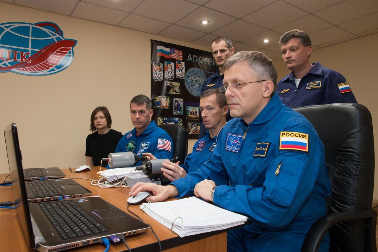 Expedition 49 flight engineer Shane Kimbrough of NASA, left, Soyuz commander Sergey Ryzhikov of Roscosmos, center, and flight engineer Andrey Borisenko of Roscosmos, right, work on Soyuz training at the Cosmonaut Hotel on Friday, Sept. 16, 2016 in Baikonur, Kazakhstan. Kimbrough, Ryzhikov, and Borisenko are scheduled to launch to the International Space Station aboard the Soyuz MS-02 spacecraft from the Baikonur Cosmodrome on September 24 Kazakh time. Photo Credit: (NASA/Victor Zelentsov)