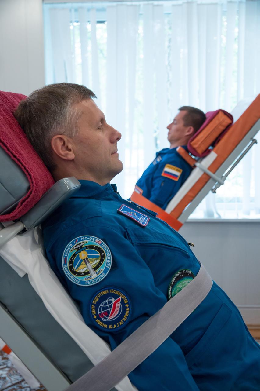 Expedition 49 flight engineer Andrey Borisenko of Roscosmos, in foreground, and Soyuz commander Sergey Ryzhikov of Roscosmos take part in tilt table training during media day on Friday, Sept. 16, 2016 at the Cosmonaut Hotel in Baikonur, Kazakhstan. Expedition 49 flight engineer Shane Kimbrough of NASA, flight engineer Andrey Borisenko of Roscosmos, and Soyuz commander Sergey Ryzhikov of Roscosmos are scheduled to launch to the International Space Station aboard the Soyuz MS-02 spacecraft from the Baikonur Cosmodrome on September 24 Kazakh time. Photo Credit: (NASA/Victor Zelentsov)