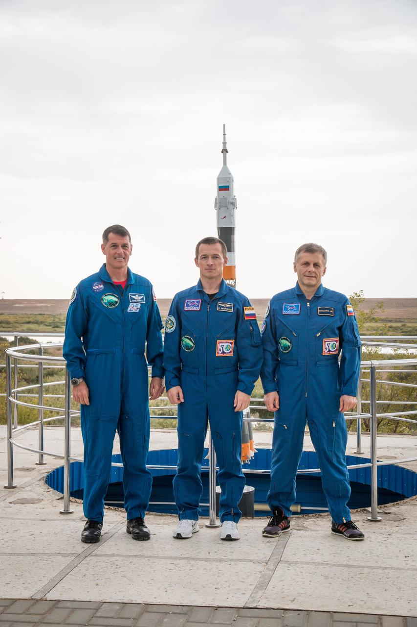 Expedition 49 flight engineer Shane Kimbrough of NASA, left, Soyuz commander Sergey Ryzhikov of Roscosmos, center, and flight engineer Andrey Borisenko of Roscosmos left, pose for a group picture by a model of the Soyuz rocket during media day at the Cosmonaut Hotel on Friday, Sept. 16, 2016 in Baikonur, Kazakhstan. Kimbrough, Ryzhikov, and Borisenko are scheduled to launch to the International Space Station aboard the Soyuz MS-02 spacecraft from the Baikonur Cosmodrome on September 24 Kazakh time. Photo Credit: (NASA/Victor Zelentsov)