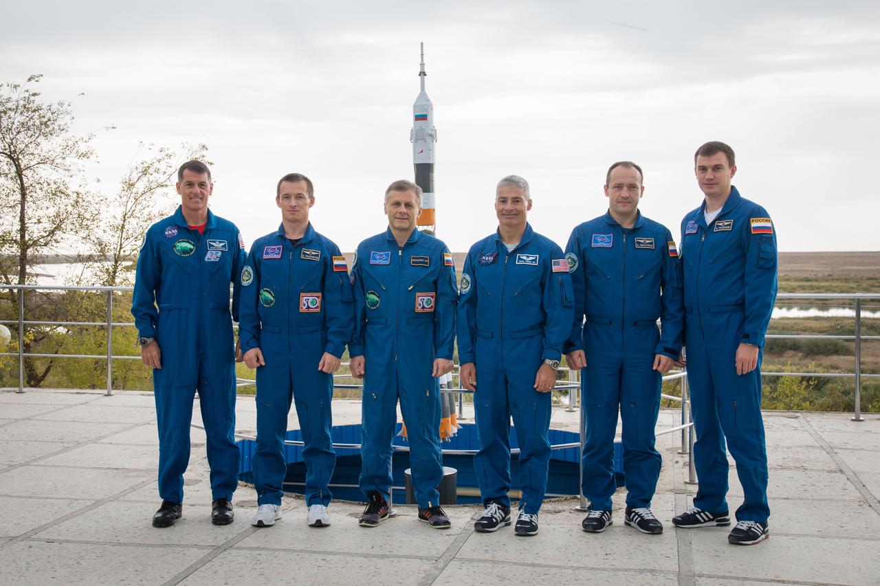 Expedition 49 flight engineer Shane Kimbrough of NASA, left, Soyuz commander Sergey Ryzhikov of Roscosmos, second from left, and flight engineer Andrey Borisenko of Roscosmos third from left, pose for a picture with backup crew members Mark Vande Hei of NASA, third from right, Alexander Misurkin of Roscosmos, second from right, and Nikolai Tikhonov of Roscosmos, right, infront of at the Cosmonaut Hotel on Friday, Sept. 16, 2016 in Baikonur, Kazakhstan. Kimbrough, Ryzhikov, and Borisenko are scheduled to launch to the International Space Station aboard the Soyuz MS-02 spacecraft from the Baikonur Cosmodrome on September 24 Kazakh time. Photo Credit: (NASA/Victor Zelentsov)