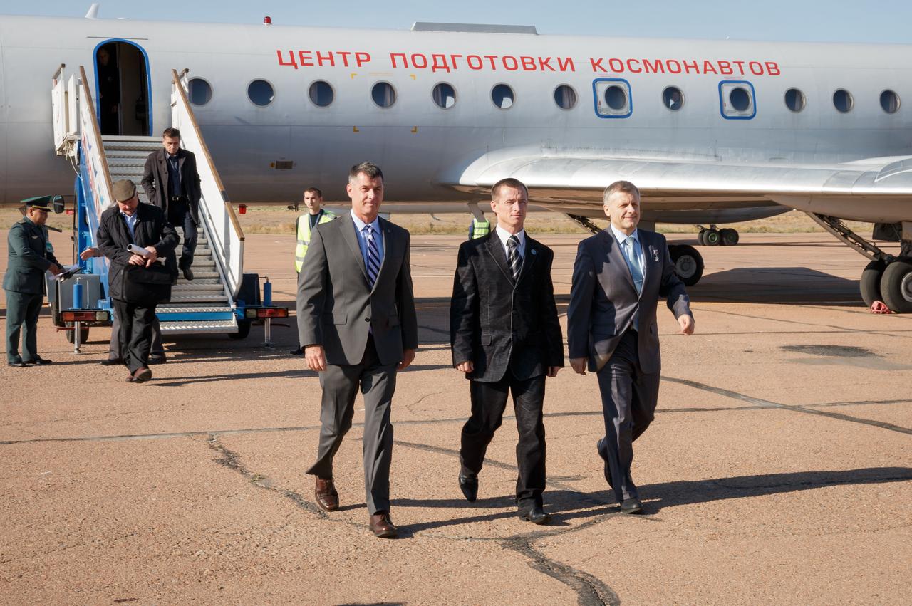 Expedition 49 crew members Shane Kimbrough of NASA, left, Sergey Ryzhikov, center, and Andrey Borisenko of Roscosmos, left, exit the Gagarin Cosmonaut Training Center (GCTC) aircraft after arriving in Baikonur, Kazakhstan on Friday, Oct. 7, 2016. The trio are preparing for launch to the International Space Station in their Soyuz MS-02 spacecraft from the Baikonur Cosmodrome in Kazakhstan on October 19, 2016. Photo Credit: (NASA/Victor Zelentsov)