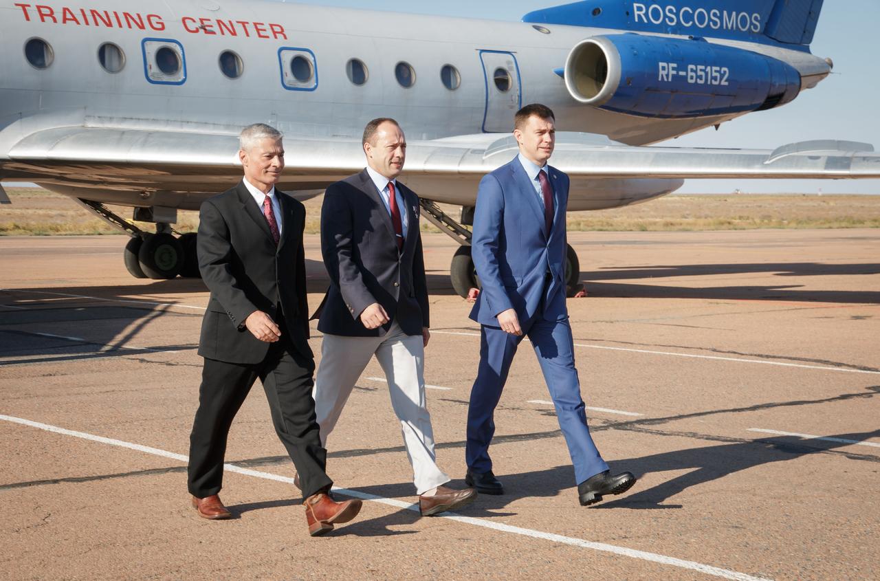 Expedition 49 backup crew members Mark Vande Hei of NASA, left, Alexander Misurkin, center, and Nikolai Tikhonov of Roscomos, left, exit the Gagarin Cosmonaut Training Center (GCTC) aircraft after arriving in Baikonur, Kazakhstan on Friday, Oct. 7, 2016. The trio are preparing for launch to the International Spacestation in their Soyuz MS-02 spacecraft from the Baikonur Cosmodrome in Kazakhstan on October 19, 2016. Photo Credit: (NASA/Victor Zelentsov)