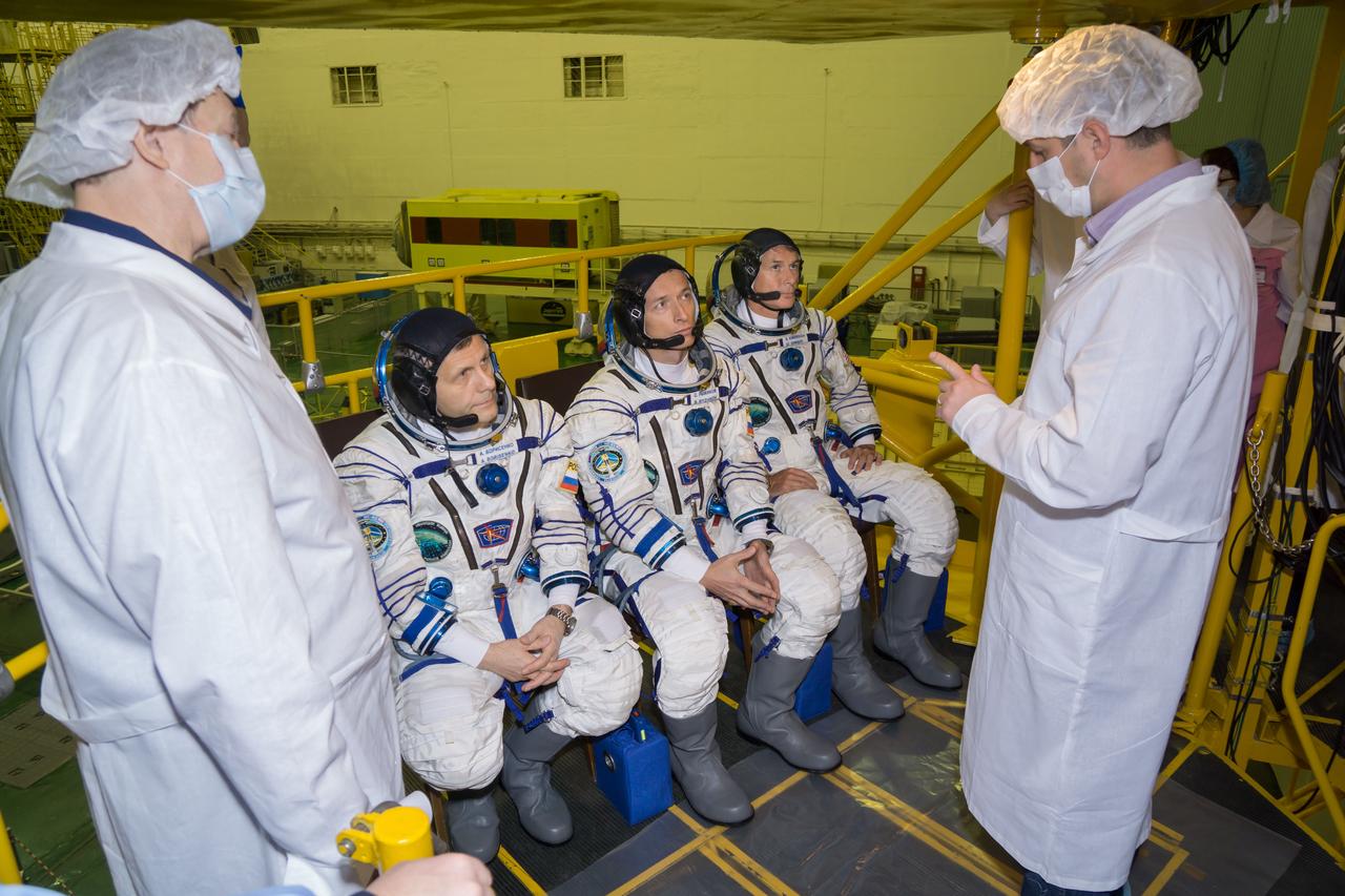 Technicians talk with Expedition 49 flight engineer Andrey Borisenko of Roscosmos, left, Soyuz commander Sergey Ryzhikov of Roscosmos, center, and flight engineer Shane Kimbrough of NASA, right, during their first check dress rehearsal activities, Saturday, Oct. 8, 2016 at the Baikonur Cosmodrome in Kazakhstan. Kimbrough, Ryzhikov, and Borsenko will launch from the Baikonur Cosmodrome in Kazakhstan on Oct. 19. Photo Credit: (NASA/Victor Zelentsov)