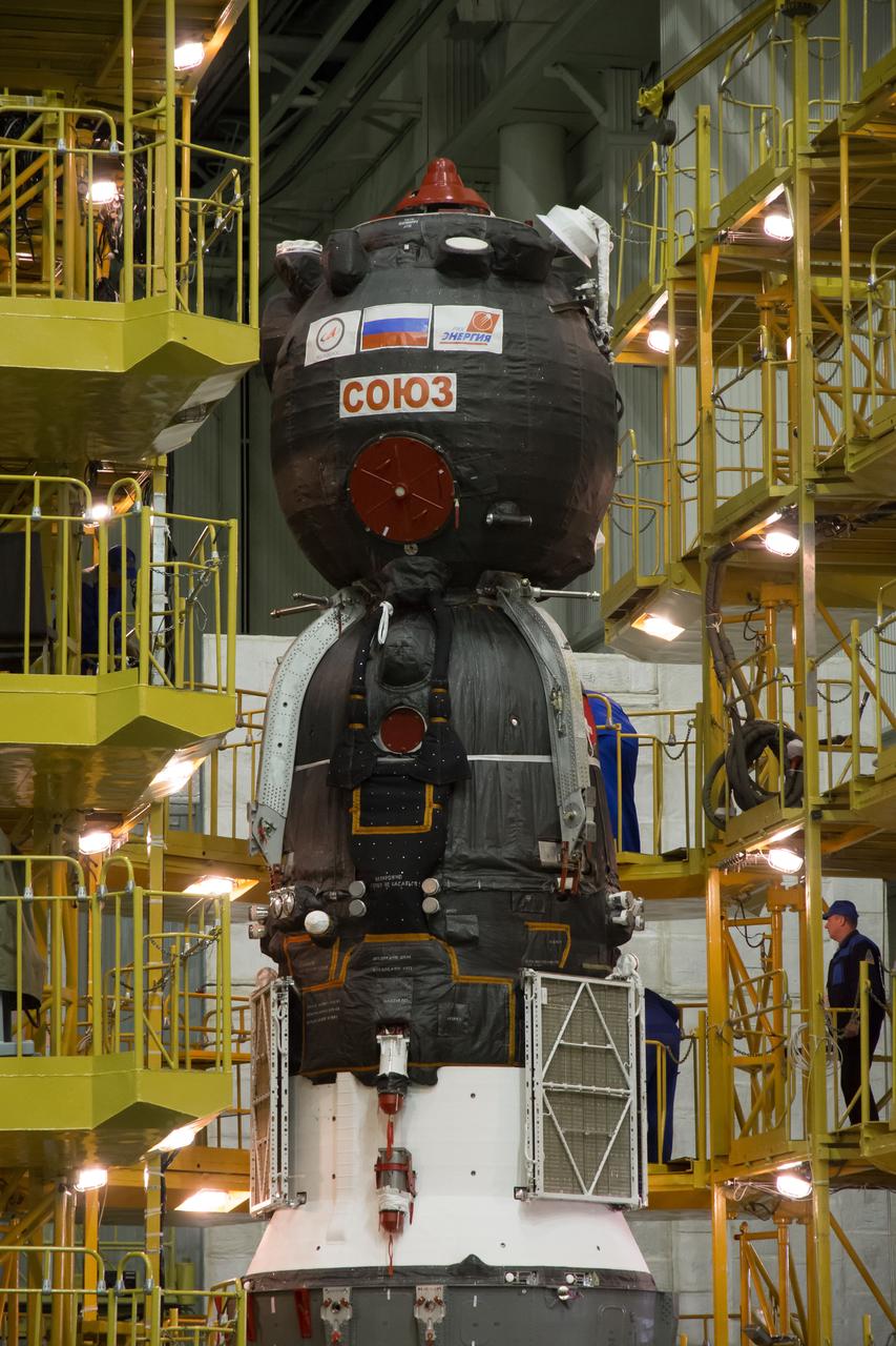 The Soyuz MS-02 spacecraft is seen as the work platforms around it are retracted in preparation for being encapsulated in its fairing on Thursday, Tuesday, Oct. 11, 2016 at the Baikonur Cosmodrome in Kazakhstan. Expedition 49 flight engineer Shane Kimbrough of NASA, flight engineer Andrey Borisenko of Roscosmos, and Soyuz commander Sergey Ryzhikov of Roscosmos are scheduled to launch from the Baikonur Cosmodrome in Kazakhstan on Oct. 19. Photo Credit: (NASA/Victor Zelentsov)