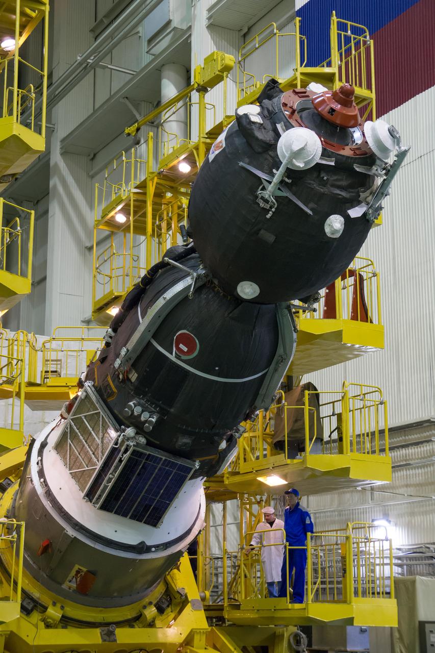 The Soyuz MS-02 spacecraft is seen as it is rotated from a vertical to a horizontal position in preparation for being encapsulated in its fairing on Thursday, Tuesday, Oct. 11, 2016 at the Baikonur Cosmodrome in Kazakhstan. Expedition 49 flight engineer Shane Kimbrough of NASA, flight engineer Andrey Borisenko of Roscosmos, and Soyuz commander Sergey Ryzhikov of Roscosmos are scheduled to launch from the Baikonur Cosmodrome in Kazakhstan on Oct. 19. Photo Credit: (NASA/Victor Zelentsov)