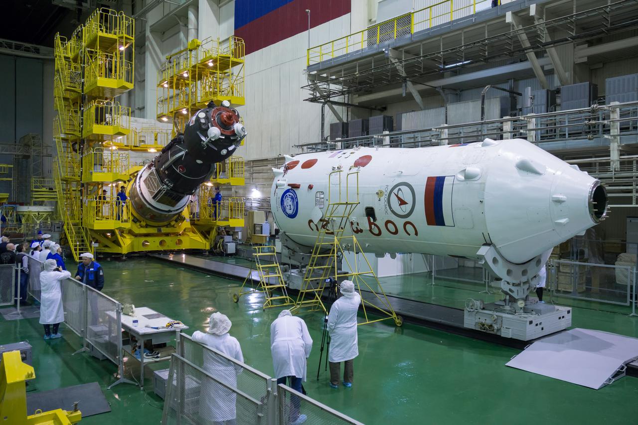 The Soyuz MS-02 spacecraft is seen as it is rotated from a vertical to a horizontal position in preparation for being encapsulated in its fairing on Thursday, Tuesday, Oct. 11, 2016 at the Baikonur Cosmodrome in Kazakhstan. Expedition 49 flight engineer Shane Kimbrough of NASA, flight engineer Andrey Borisenko of Roscosmos, and Soyuz commander Sergey Ryzhikov of Roscosmos are scheduled to launch from the Baikonur Cosmodrome in Kazakhstan on Oct. 19. Photo Credit: (NASA/Victor Zelentsov)