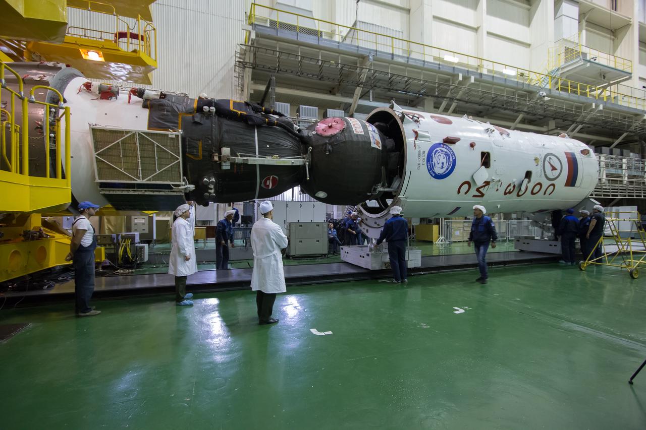 The Soyuz MS-02 spacecraft is seen while being encapsulated in its fairing on Thursday, Tuesday, Oct. 11, 2016 at the Baikonur Cosmodrome in Kazakhstan. Expedition 49 flight engineer Shane Kimbrough of NASA, flight engineer Andrey Borisenko of Roscosmos, and Soyuz commander Sergey Ryzhikov of Roscosmos are scheduled to launch from the Baikonur Cosmodrome in Kazakhstan on Oct. 19. Photo Credit: (NASA/Victor Zelentsov)
