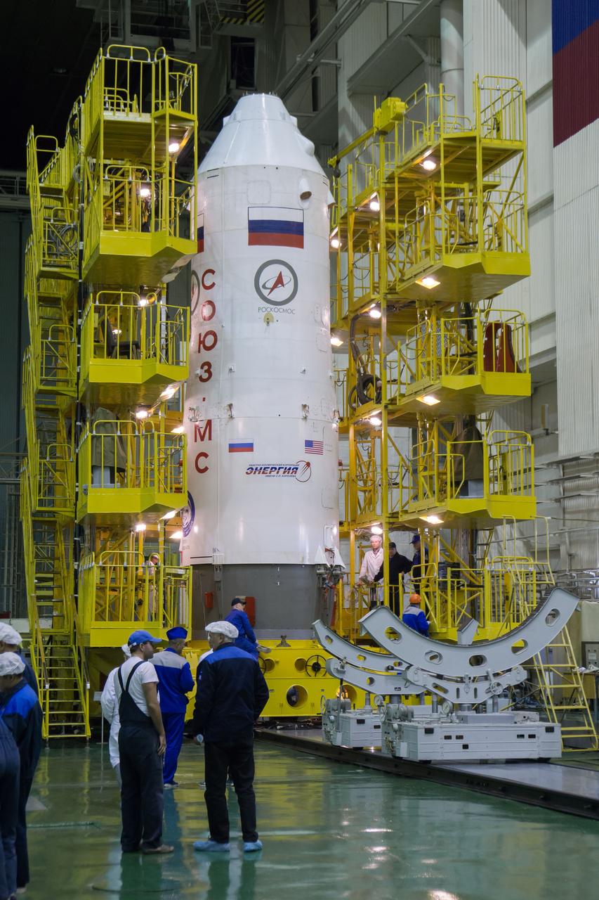 The Soyuz MS-02 spacecraft, encapsulated in its fairing, is rotated from a horizontal position back into a vertical position in its work platform on Thursday, Tuesday, Oct. 11, 2016 at the Baikonur Cosmodrome in Kazakhstan. Expedition 49 flight engineer Shane Kimbrough of NASA, flight engineer Andrey Borisenko of Roscosmos, and Soyuz commander Sergey Ryzhikov of Roscosmos are scheduled to launch from the Baikonur Cosmodrome in Kazakhstan on Oct. 19. Photo Credit: (NASA/Victor Zelentsov)
