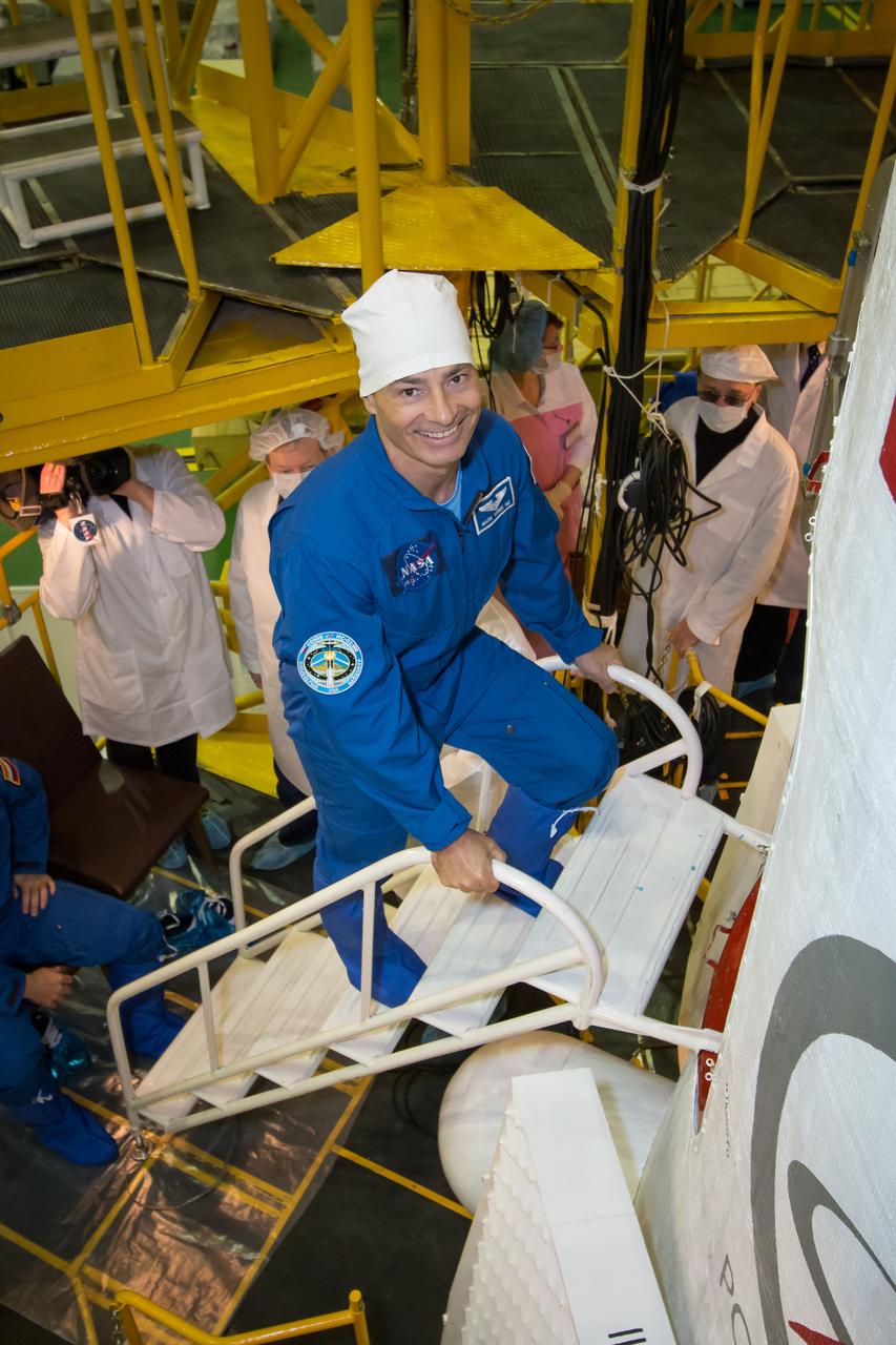Expedition 49 backup crew member Mark Vande Hei of NASA climbs the stairs to enter the Soyuz MS-02 spacecraft during the final fit check of the spacecraft on Thursday, Oct. 13, 2016 at the Baikonur Cosmodrome in Kazakhstan. Expedition 49 flight engineer Shane Kimbrough of NASA, flight engineer Andrey Borisenko of Roscosmos, and Soyuz commander Sergey Ryzhikov of Roscosmos are scheduled to launch from the Baikonur Cosmodrome in Kazakhstan on Oct. 19. Photo Credit: (NASA/Victor Zelentsov)