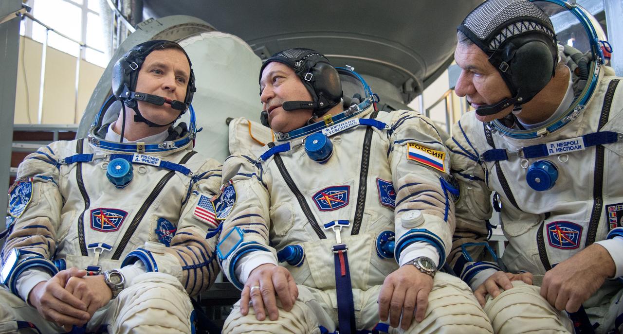 Expedition 50 backup crew members, NASA astronaut Jack Fisher, left, Russian cosmonaut Fyodor Yurchikhin of Roscosmos, center, and ESA astronaut Paolo Nespoli, left, answer questions from the press ahead of their Soyuz qualification exams, Monday, Oct. 24, 2016, at the Gagarin Cosmonaut Training Center (GCTC) in Star City, Russia. Photo Credit: (NASA/Bill Ingalls)