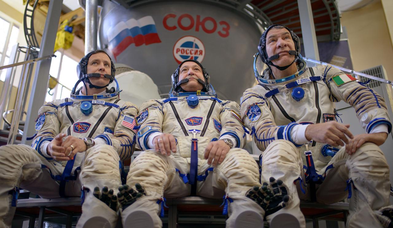 Expedition 50 backup crew members, NASA astronaut Jack Fisher, left, Russian cosmonaut Fyodor Yurchikhin of Roscosmos, center, and ESA astronaut Paolo Nespoli, left, answer questions from the press ahead of their Soyuz qualification exams, Monday, Oct. 24, 2016, at the Gagarin Cosmonaut Training Center (GCTC) in Star City, Russia. Photo Credit: (NASA/Bill Ingalls)