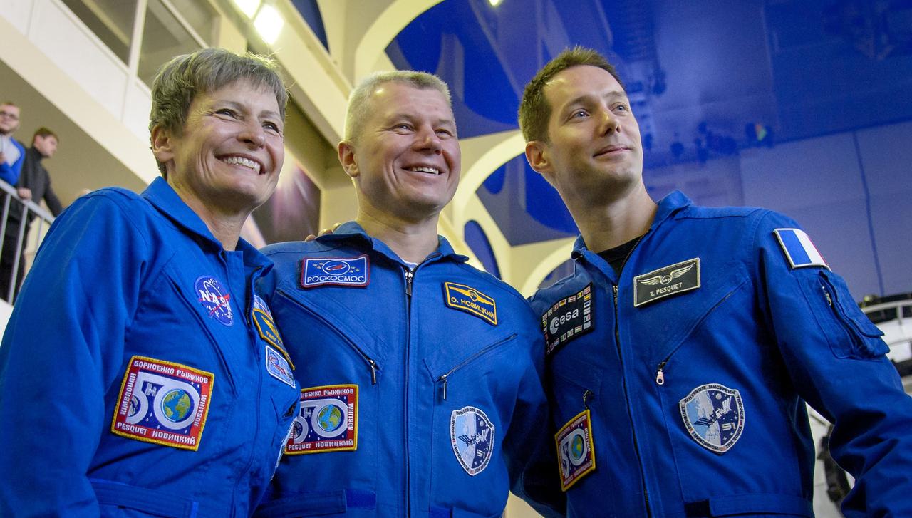 Expedition 50 crew members NASA astronaut Peggy Whitson, left, Russian cosmonaut Oleg Novitskiy of Roscosmos, center, and ESA astronaut Thomas Pesquet pose for a group photograph ahead of their Soyuz qualification exams, Monday, Oct. 24, 2016, at the Gagarin Cosmonaut Training Center (GCTC) in Star City, Russia. Photo Credit: (NASA/Bill Ingalls)