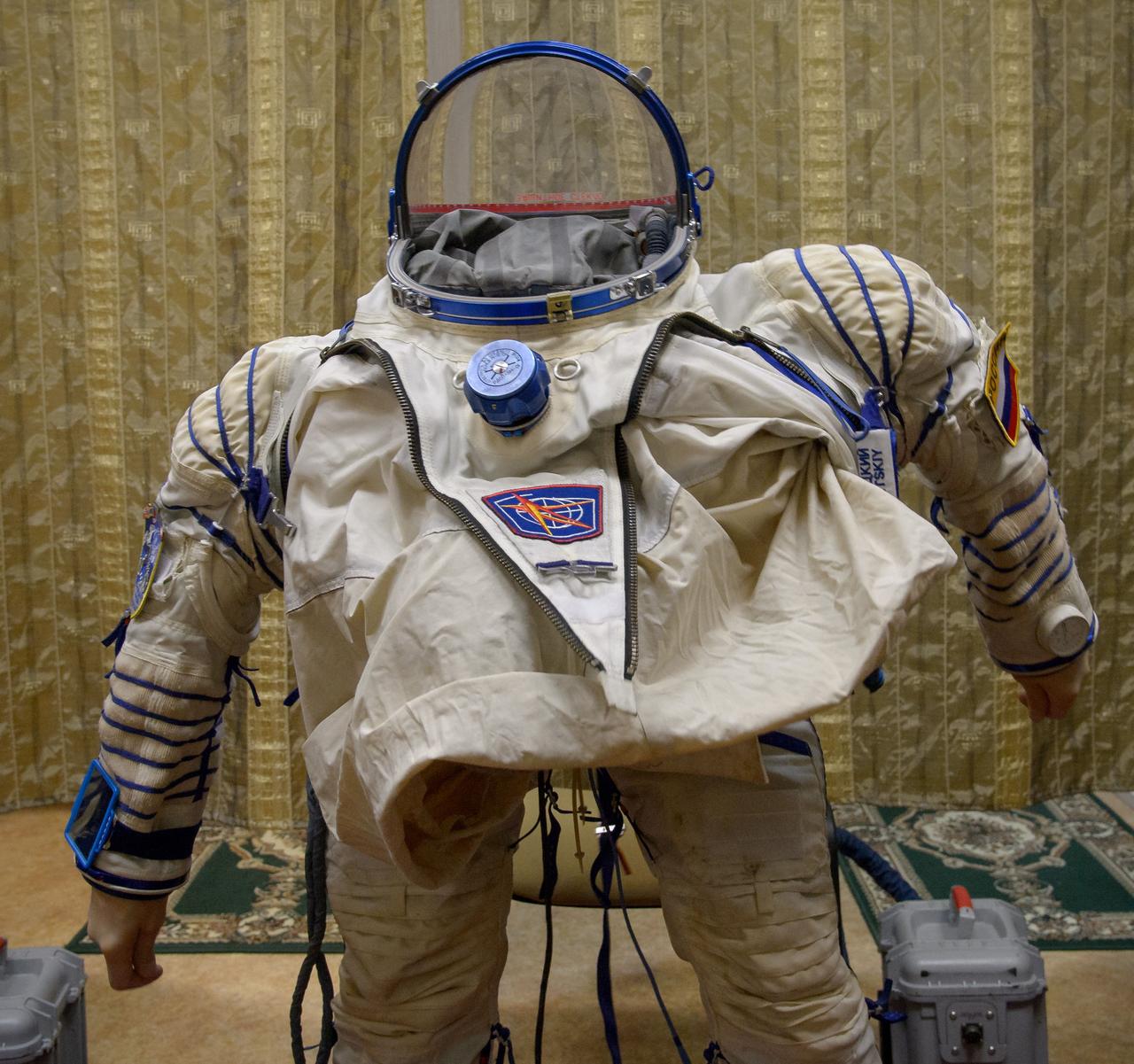 Expedition 50 Russian cosmonaut Oleg Novitskiy of Roscosmos dons his Sokol suit ahead of his final qualification exams with fellow crew mates NASA astronaut Peggy Whitson and ESA astronaut Thomas Pesquet, Tuesday, Oct. 25, 2016, at the Gagarin Cosmonaut Training Center (GCTC) in Star City, Russia. Photo Credit: (NASA/Bill Ingalls)