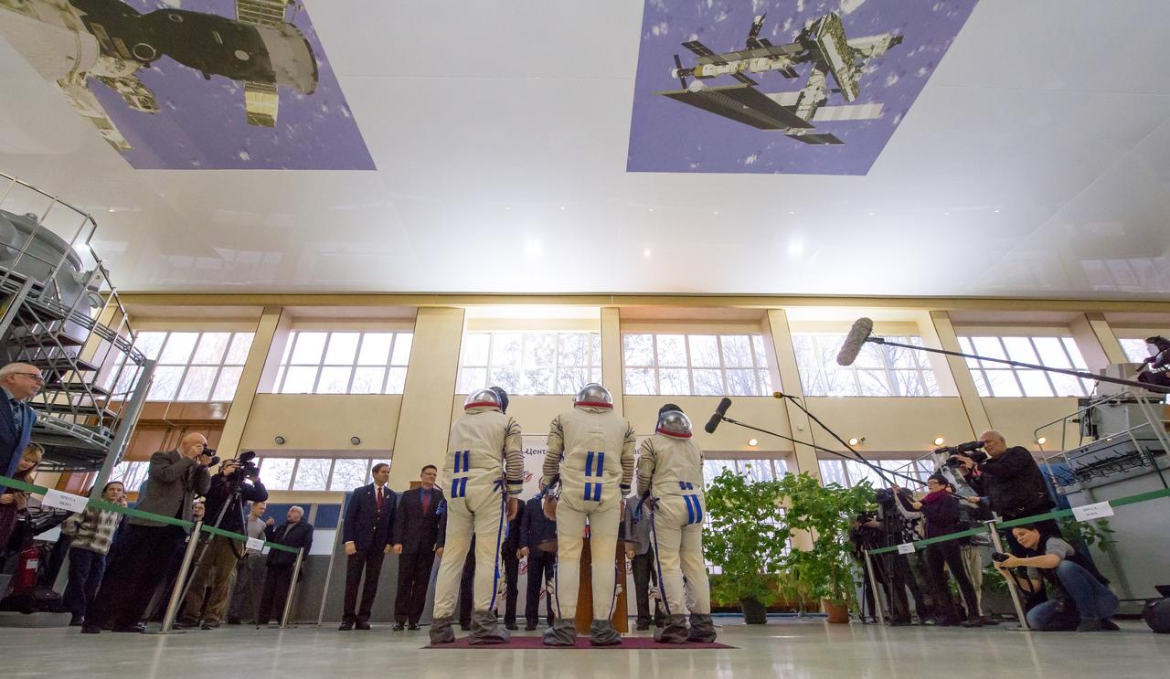 Expedition 50 crew members ESA astronaut Thomas Pesquet, left, Russian cosmonaut Oleg Novitskiy of Roscosmos, center, and NASA astronaut Peggy Whitson report to mission managers for their final qualification exams, Tuesday, Oct. 25, 2016, at the Gagarin Cosmonaut Training Center (GCTC) in Star City, Russia. Photo Credit: (NASA/Bill Ingalls)