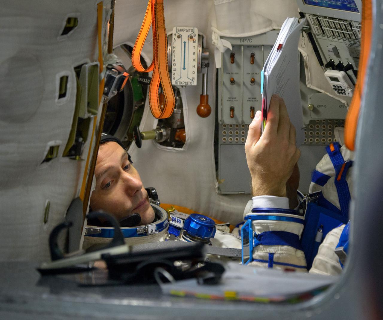 Expedition 50 ESA astronaut Thomas Pesquet is seen inside the Soyuz simulator during final qualification exams, Tuesday, Oct. 25, 2016, at the Gagarin Cosmonaut Training Center (GCTC) in Star City, Russia. Pesquet, Russian cosmonaut Oleg Novitskiy of Roscosmos, and NASA astronaut Peggy Whitson are scheduled to launch in November 2016. Photo Credit: (NASA/Bill Ingalls)