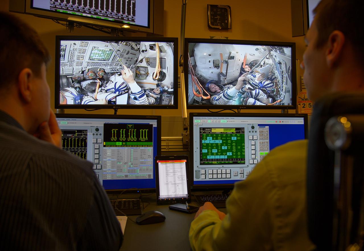 Expedition 50 crew members ESA astronaut Thomas Pesquet, Russian cosmonaut Oleg Novitskiy of Roscosmos, and NASA astronaut Peggy Whitson are seen on the monitors of the Soyuz simulator control room during final qualification exams, Tuesday, Oct. 25, 2016, at the Gagarin Cosmonaut Training Center (GCTC) in Star City, Russia. Photo Credit: (NASA/Bill Ingalls)