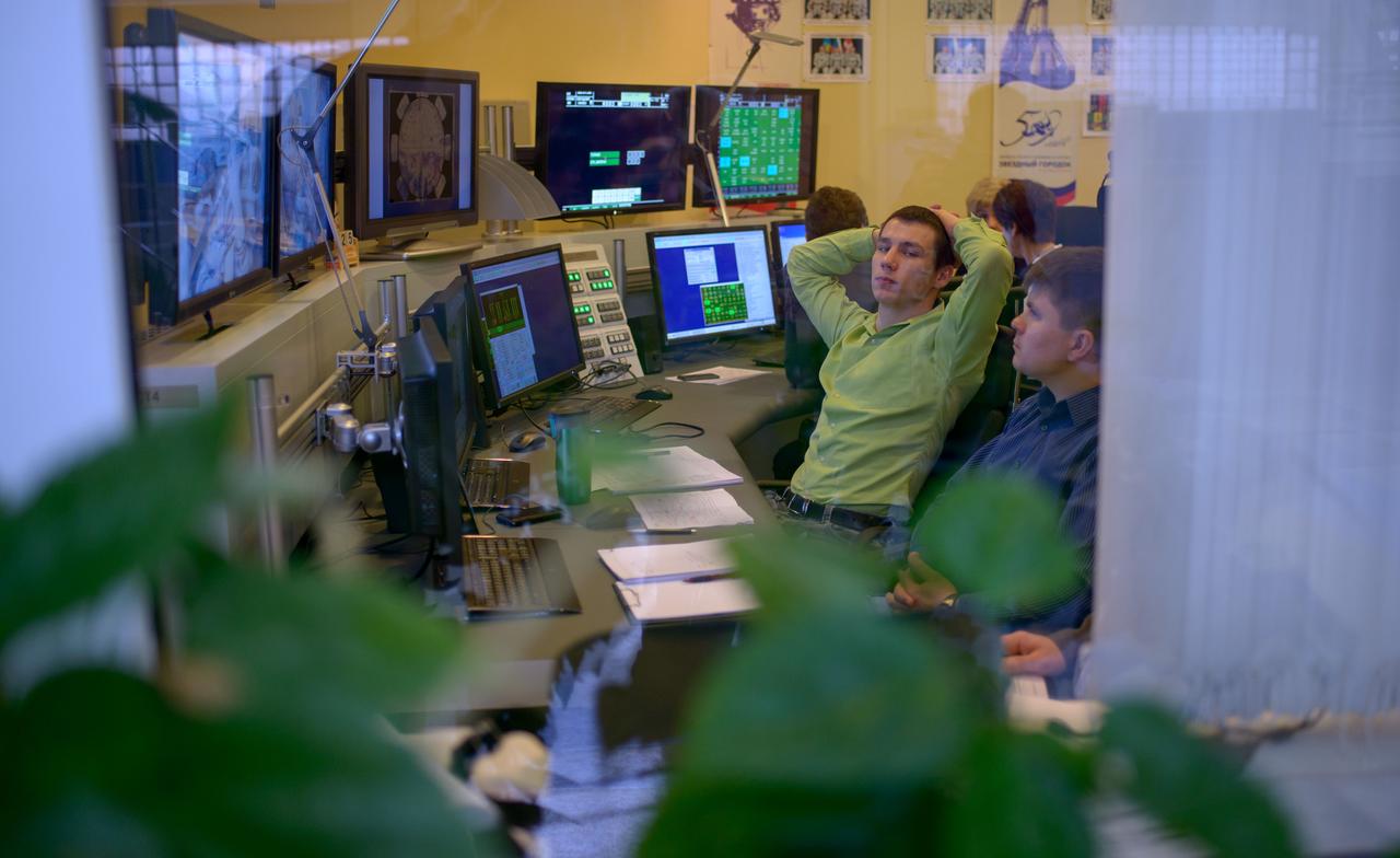 Engineers in a nearby control room monitor Expedition 50 crew members ESA astronaut Thomas Pesquet, Russian cosmonaut Oleg Novitskiy of Roscosmos, and NASA astronaut Peggy Whitson as they perform their final qualification exams in a Soyuz simulator, Tuesday, Oct. 25, 2016, at the Gagarin Cosmonaut Training Center (GCTC) in Star City, Russia. Photo Credit: (NASA/Bill Ingalls)