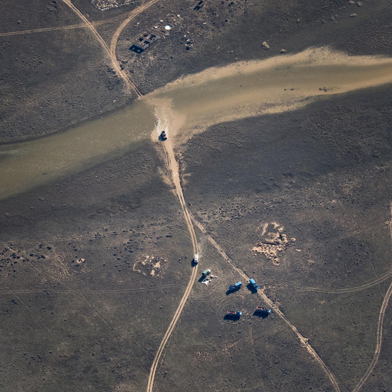 nhq201704100014 (April 10, 2017) --- Russian Search and Rescue teams chase the Soyuz MS-02 spacecraft as it lands with Expedition 50 Commander Shane Kimbrough of NASA and Flight Engineers Sergey Ryzhikov and Andrey Borisenko of Roscosmos near the town of Zhezkazgan, Kazakhstan on Monday, April 10, 2017 (Kazakh time). Kimbrough, Ryzhikov, and Borisenko are returning after 173 days in space where they served as members of the Expedition 49 and 50 crews onboard the International Space Station. Photo Credit: (NASA/Bill Ingalls)