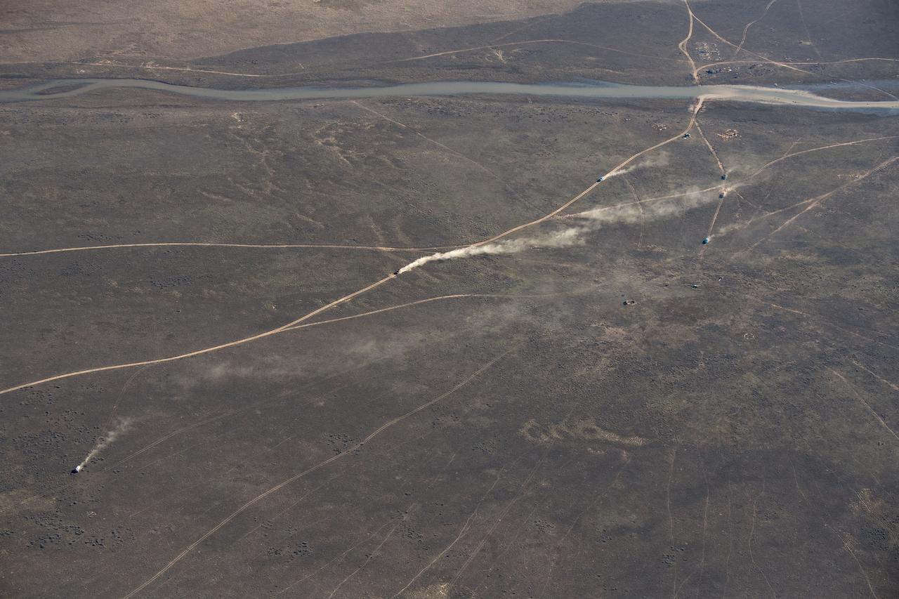 nhq201704100015 (April 10, 2017) ---  Russian Search and Rescue teams chase the Soyuz MS-02 spacecraft as it lands with Expedition 50 Commander Shane Kimbrough of NASA and Flight Engineers Sergey Ryzhikov and Andrey Borisenko of Roscosmos near the town of Zhezkazgan, Kazakhstan on Monday, April 10, 2017 (Kazakh time). Kimbrough, Ryzhikov, and Borisenko are returning after 173 days in space where they served as members of the Expedition 49 and 50 crews onboard the International Space Station. Photo Credit: (NASA/Bill Ingalls)