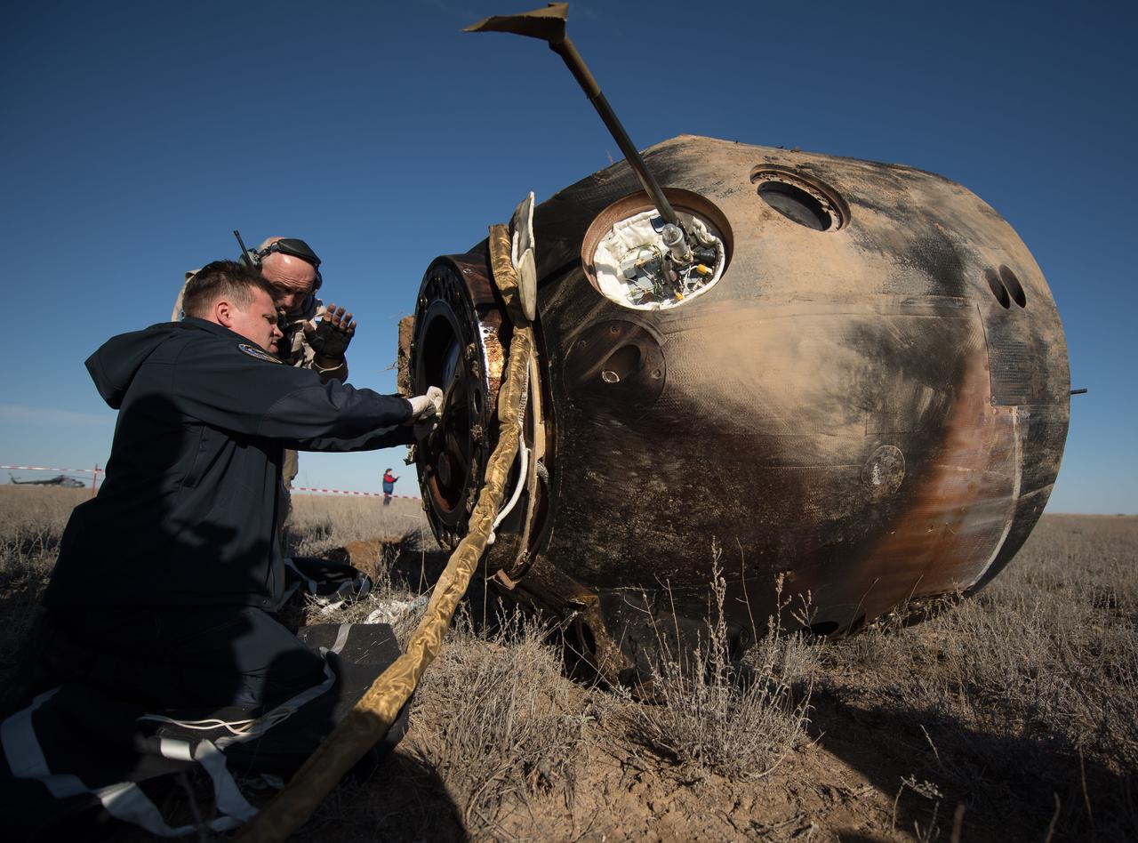 nhq201704100022 (April 10, 2017) --- Russian Search and Rescue teams arrive at the Soyuz MS-02 spacecraft shortly after it landed with Expedition 50 Commander Shane Kimbrough of NASA and Flight Engineers Sergey Ryzhikov and Andrey Borisenko of Roscosmos near the town of Zhezkazgan, Kazakhstan on Monday, April 10, 2017 (Kazakh time). Kimbrough, Ryzhikov, and Borisenko are returning after 173 days in space where they served as members of the Expedition 49 and 50 crews onboard the International Space Station. Photo Credit: (NASA/Bill Ingalls)