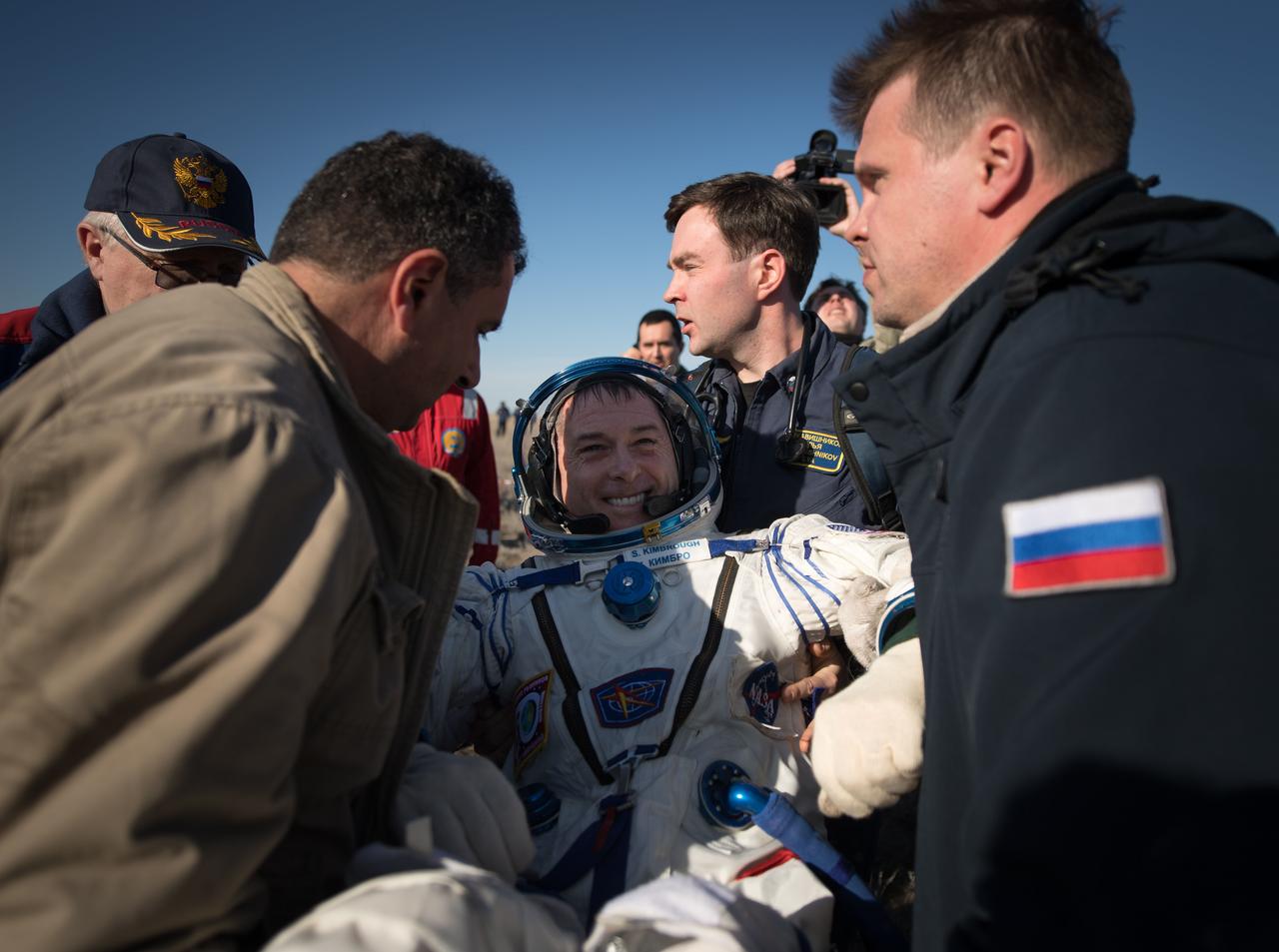 nhq201704100026 (April 10, 2017) --- NASA astronaut Shane Kimbrough is helped out of the Soyuz MS-02 spacecraft just minutes after he, Russian cosmonaut Sergey Ryzhikov of Roscosmos, and Russian cosmonaut Andrey Borisenko of Roscosmos landed in a remote area near the town of Zhezkazgan, Kazakhstan on Monday, April 10, 2017 (Kazakh time). Kimbrough, Ryzhikov, and Borisenko are returning after 173 days in space where they served as members of the Expedition 49 and 50 crews onboard the International Space Station. Photo Credit: (NASA/Bill Ingalls)