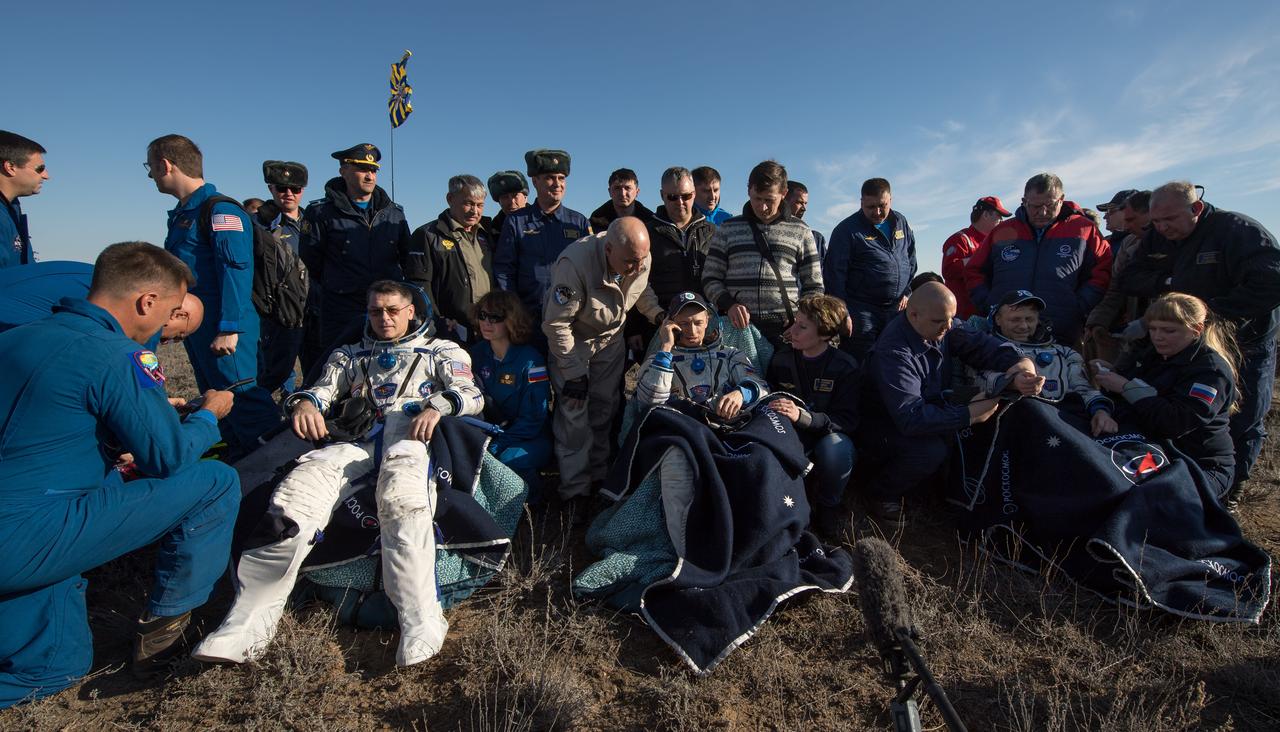 nhq201704100027 (April 10, 2017) --- NASA astronaut Shane Kimbrough, left, Russian cosmonaut Sergey Ryzhikov of Roscosmos, center, and Russian cosmonaut Andrey Borisenko of Roscosmos sit in chairs outside the Soyuz MS-02 spacecraft a few moments after they landed in a remote area near the town of Zhezkazgan, Kazakhstan on Monday, April 10, 2017 (Kazakh time). Kimbrough, Ryzhikov, and Borisenko are returning after 173 days in space where they served as members of the Expedition 49 and 50 crews onboard the International Space Station. Photo Credit: (NASA/Bill Ingalls)