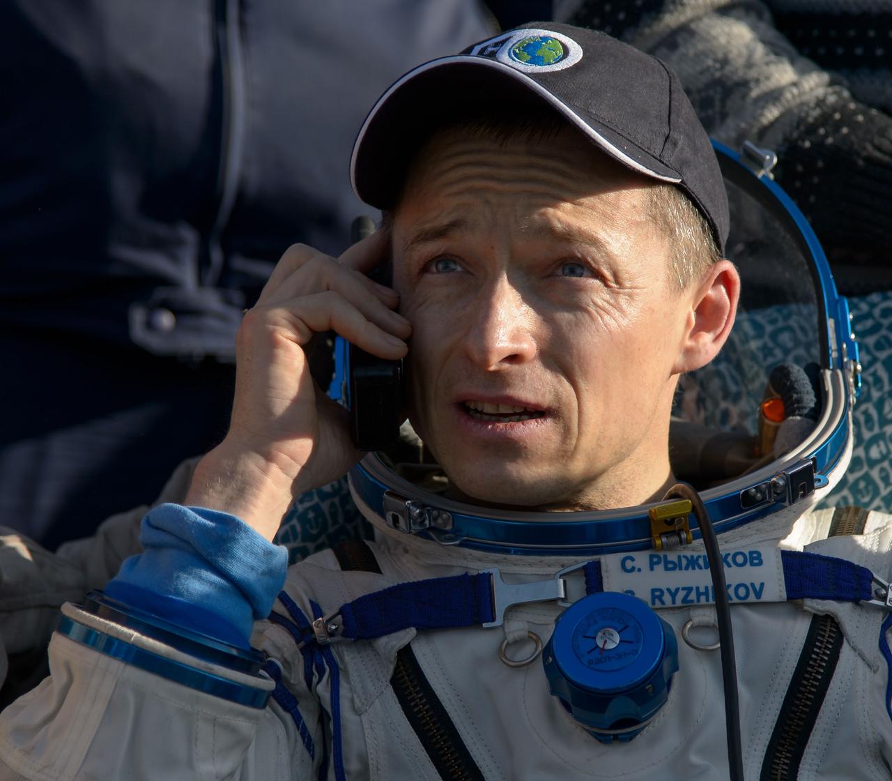 nhq201704100028 (April 10, 2017) --- Russian cosmonaut Sergey Ryzhikov of Roscosmos rests in a chair outside the Soyuz MS-02 spacecraft just minutes after he, NASA astronaut Shane Kimbrough, and Russian cosmonaut Andrey Borisenko of Roscosmos landed in a remote area near the town of Zhezkazgan, Kazakhstan on Monday, April 10, 2017 (Kazakh time). Kimbrough, Ryzhikov, and Borisenko are returning after 173 days in space where they served as members of the Expedition 49 and 50 crews onboard the International Space Station. Photo Credit: (NASA/Bill Ingalls)