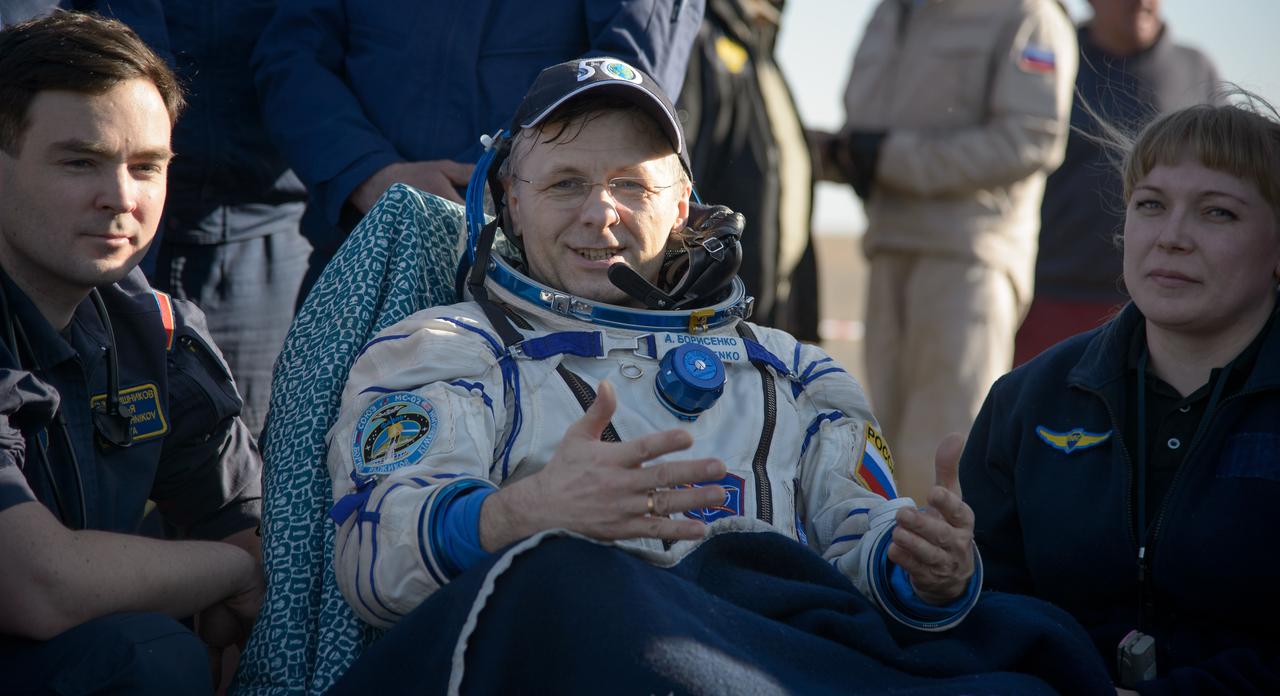 nhq201704100032 (April 10, 2017) --- Russian cosmonaut Andrey Borisenko of Roscosmos rests in a chair outside the Soyuz MS-02 spacecraft just minutes after he, NASA astronaut Shane Kimbrough, and Russian cosmonaut Sergey Ryzhikov of Roscosmos landed in a remote area near the town of Zhezkazgan, Kazakhstan on Monday, April 10, 2017 (Kazakh time). Kimbrough, Ryzhikov, and Borisenko are returning after 173 days in space where they served as members of the Expedition 49 and 50 crews onboard the International Space Station. Photo Credit: (NASA/Bill Ingalls)