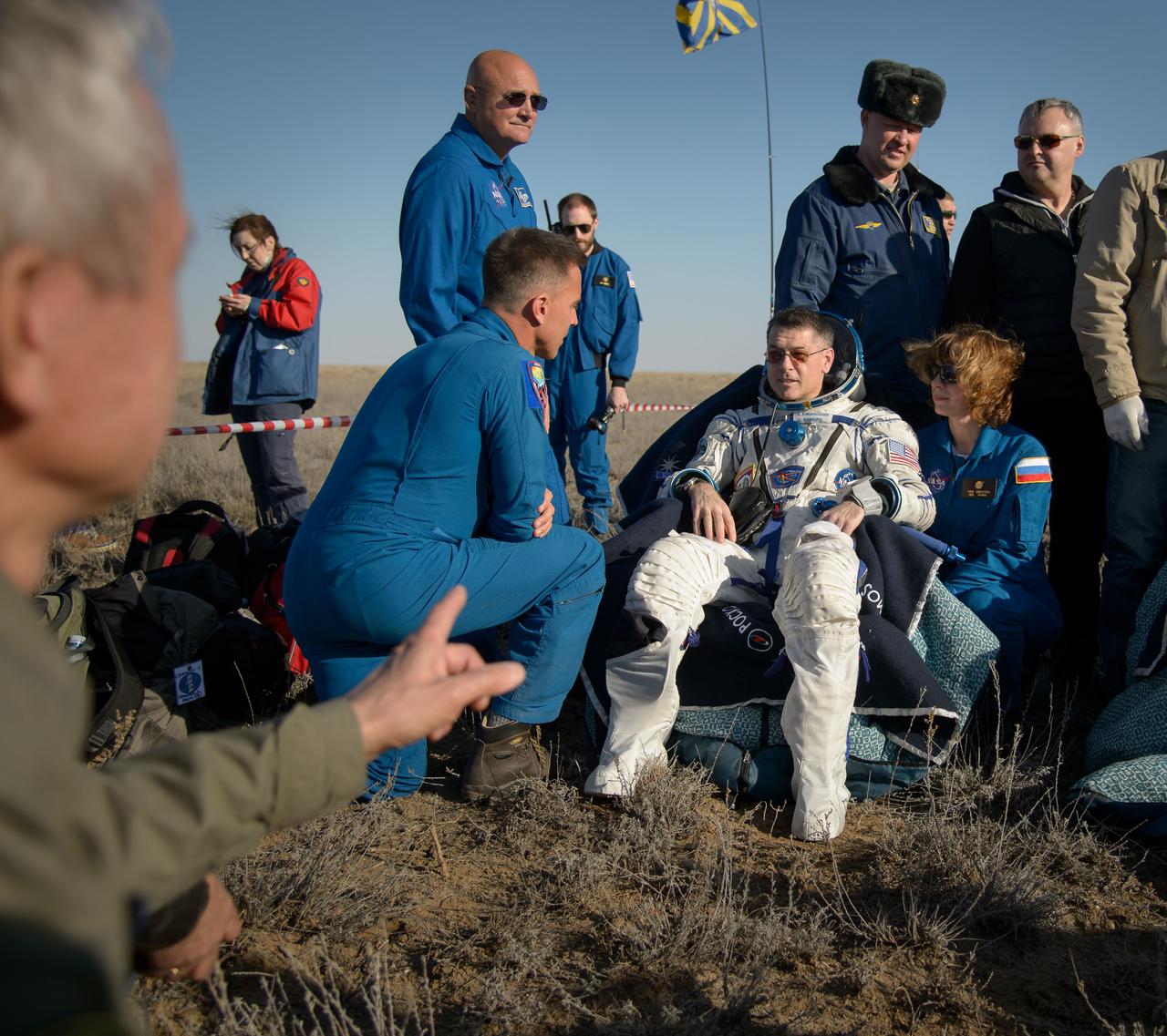 nhq201704100033 (April 10, 2017) --- NASA astronaut Shane Kimbrough rests in a chair outside the Soyuz MS-02 spacecraft just minutes after he, Russian cosmonaut Sergey Ryzhikov of Roscosmos, and Russian cosmonaut Andrey Borisenko of Roscosmos landed in a remote area near the town of Zhezkazgan, Kazakhstan on Monday, April 10, 2017 (Kazakh time). Kimbrough, Ryzhikov, and Borisenko are returning after 173 days in space where they served as members of the Expedition 49 and 50 crews onboard the International Space Station. Photo Credit: (NASA/Bill Ingalls)