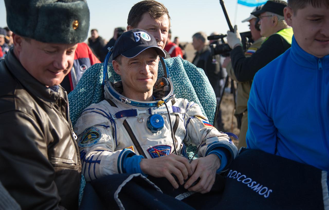 nhq201704100034 (April 10, 2017) --- Russian cosmonaut Sergey Ryzhikov of Roscosmos is carried into a medical tent shortly after he, NASA astronaut Shane Kimbrough, and Russian cosmonaut Andrey Borisenko of Roscosmos landed in their Soyuz MS-02 spacecraft in a remote area near the town of Zhezkazgan, Kazakhstan on Monday, April 10, 2017 (Kazakh time). Kimbrough, Ryzhikov, and Borisenko are returning after 173 days in space where they served as members of the Expedition 49 and 50 crews onboard the International Space Station. Photo Credit: (NASA/Bill Ingalls)