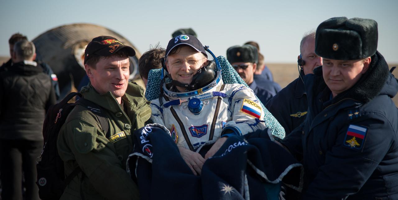 nhq201704100035 (April 10, 2017) --- Russian cosmonaut Andrey Borisenko of Roscosmos is carried into a medical tent shortly after he, NASA astronaut Shane Kimbrough, and Russian cosmonaut Sergey Ryzhikov of Roscosmos landed in their Soyuz MS-02 spacecraft in a remote area near the town of Zhezkazgan, Kazakhstan on Monday, April 10, 2017 (Kazakh time). Kimbrough, Ryzhikov, and Borisenko are returning after 173 days in space where they served as members of the Expedition 49 and 50 crews onboard the International Space Station. Photo Credit: (NASA/Bill Ingalls)