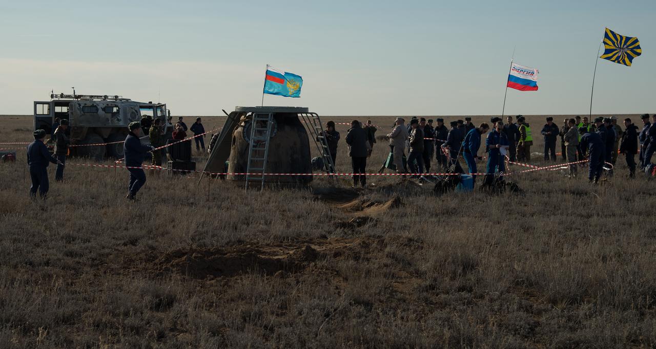 nhq201704100039 (April 10, 2017) --- Russian support personnel work around the Soyuz MS-02 spacecraft shortly after it landed with Expedition 50 Commander Shane Kimbrough of NASA and Flight Engineers Sergey Ryzhikov and Andrey Borisenko of Roscosmos near the town of Zhezkazgan, Kazakhstan on Monday, April 10, 2017 (Kazakh time). Kimbrough, Ryzhikov, and Borisenko are returning after 173 days in space where they served as members of the Expedition 49 and 50 crews onboard the International Space Station. Photo Credit: (NASA/Bill Ingalls)