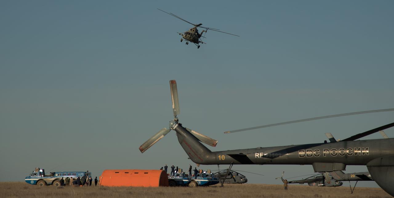 nhq201704100040 (April 10, 2017) --- A Russian support helicopter leaves the Soyuz MS-02 landing site shortly after the capsule landed with Expedition 50 Commander Shane Kimbrough of NASA and Flight Engineers Sergey Ryzhikov and Andrey Borisenko of Roscosmos near the town of Zhezkazgan, Kazakhstan on Monday, April 10, 2017 (Kazakh time). Kimbrough, Ryzhikov, and Borisenko are returning after 173 days in space where they served as members of the Expedition 49 and 50 crews onboard the International Space Station. Photo Credit: (NASA/Bill Ingalls)