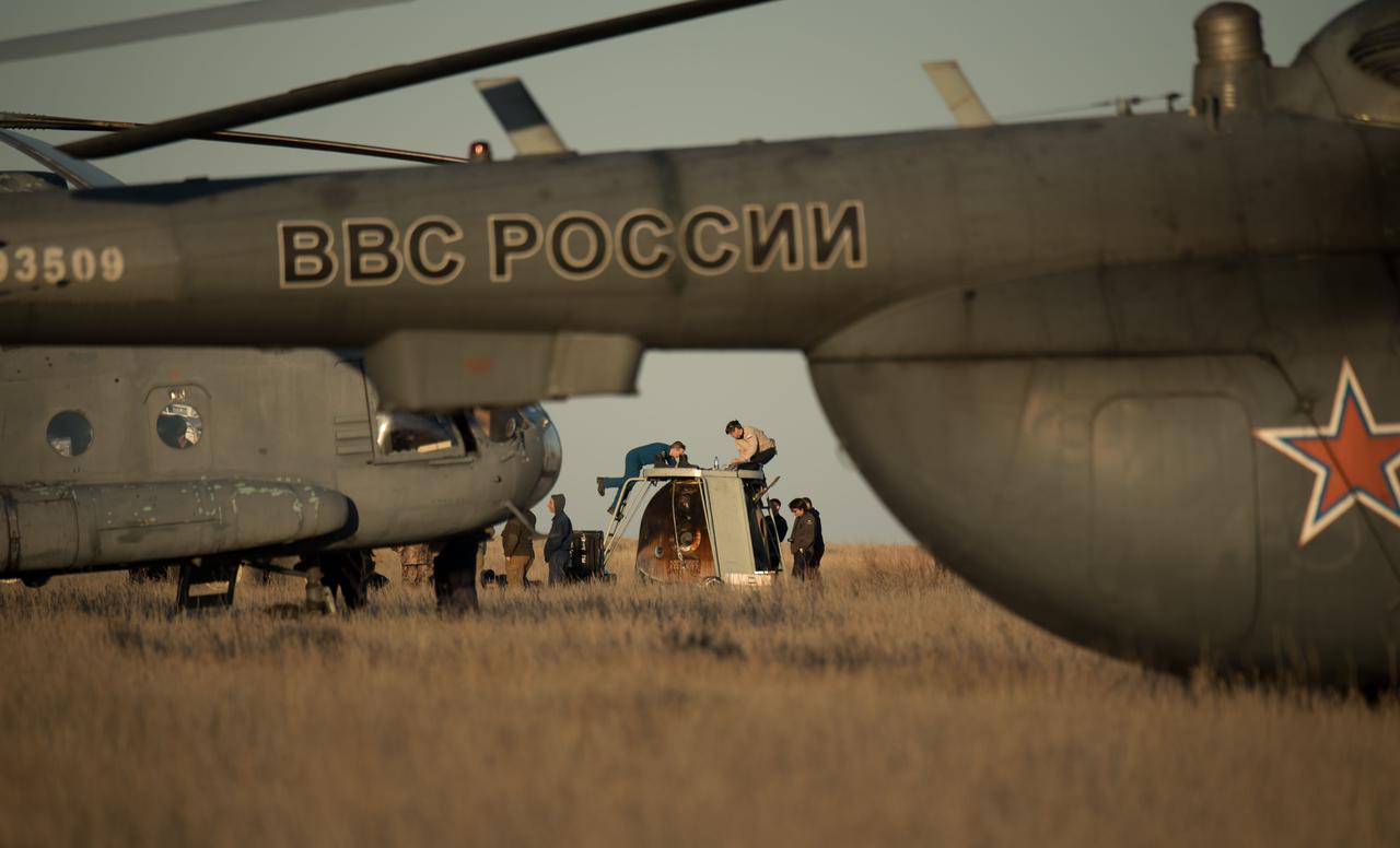 nhq201704100043 (April 10, 2017) --- American and Russian support personnel work around the Soyuz MS-02 spacecraft shortly after it landed with Expedition 50 Commander Shane Kimbrough of NASA and Flight Engineers Sergey Ryzhikov and Andrey Borisenko of Roscosmos near the town of Zhezkazgan, Kazakhstan on Monday, April 10, 2017 (Kazakh time). Kimbrough, Ryzhikov, and Borisenko are returning after 173 days in space where they served as members of the Expedition 49 and 50 crews onboard the International Space Station. Photo Credit: (NASA/Bill Ingalls)