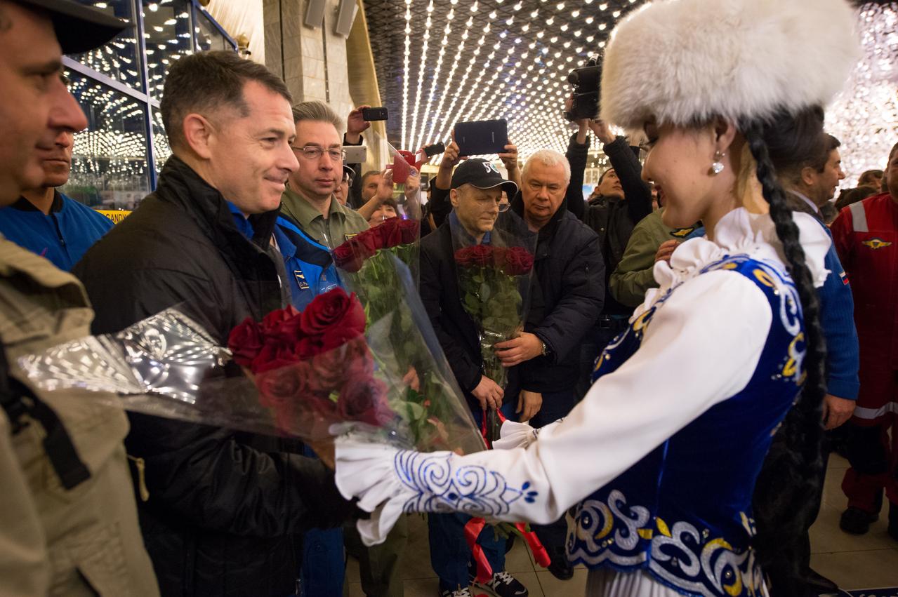 nhq201704100051 (April 10, 2017) --- Girls in traditional Kazakhstan dress welcome back from space Expedition 50 Commander Shane Kimbrough of NASA and Flight Engineers Sergey Ryzhikov and Andrey Borisenko of Roscosmos at a Karaganda Airport welcome ceremony in Kazakhstan on Monday, April 10, 2017. 2017 (Kazakh time). Kimbrough, Ryzhikov, and Borisenko are returning after 173 days in space where they served as members of the Expedition 49 and 50 crews onboard the International Space Station. Photo Credit: (NASA/Bill Ingalls)