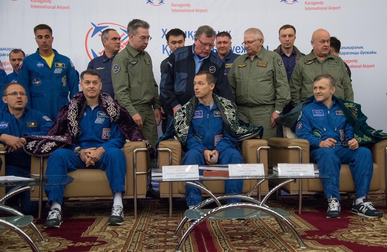 nhq201704100053 (April 10, 2017) --- Expedition 50 Commander Shane Kimbrough of NASA, left, and Flight Engineers Sergey Ryzhikov, center, and Andrey Borisenko of Roscosmos are seen at a Karaganda Airport welcome ceremony in Kazakhstan on Monday, April 10, 2017. 2017 (Kazakh time). Kimbrough, Ryzhikov, and Borisenko are returning after 173 days in space where they served as members of the Expedition 49 and 50 crews onboard the International Space Station. Photo Credit: (NASA/Bill Ingalls)